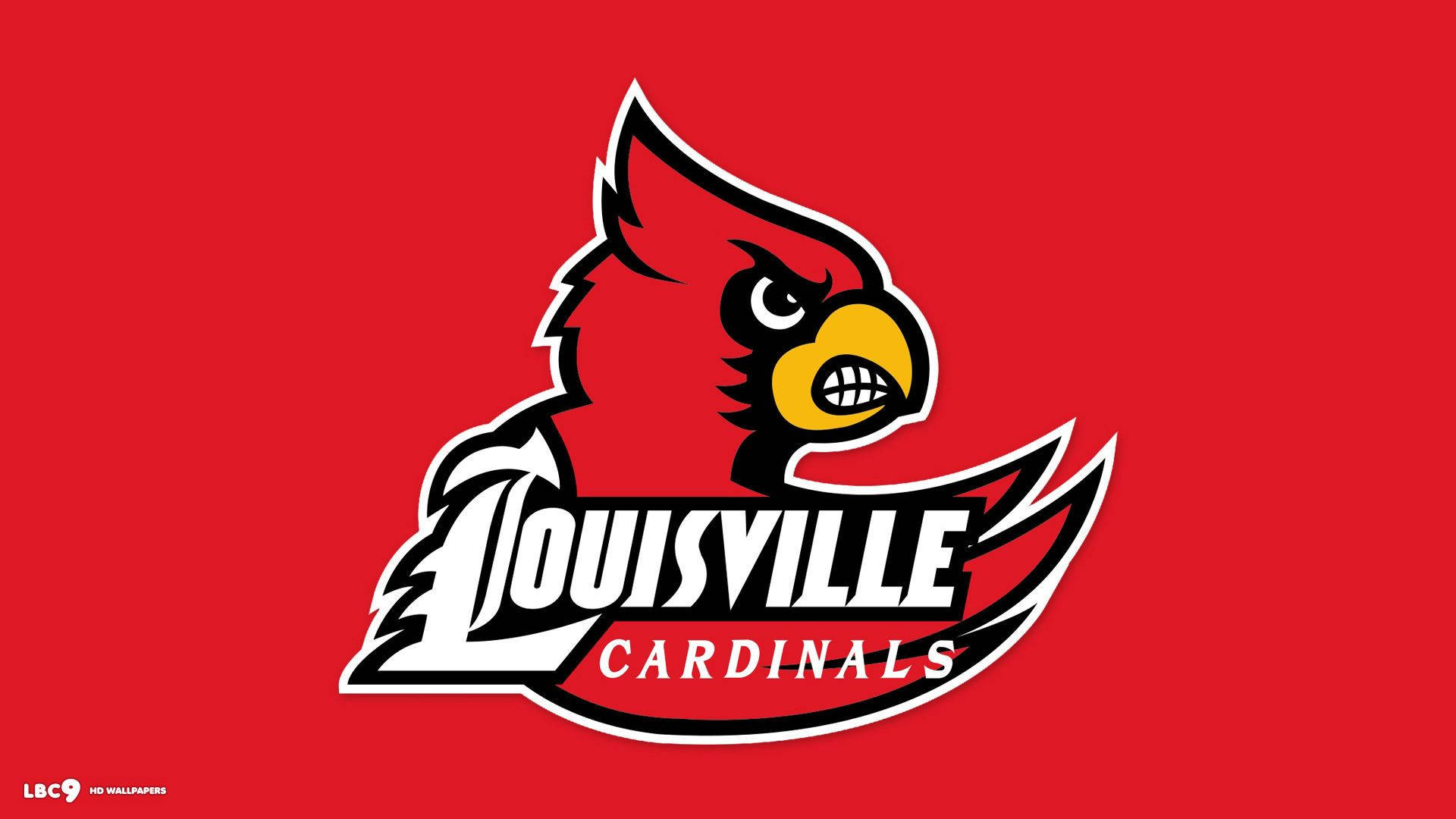 Cardinals 桌布 壁紙 — 一個大膽的紅色主教吉祥物標誌，帶有白色和黑色輪廓及黃色喙，背景為純紅色。
