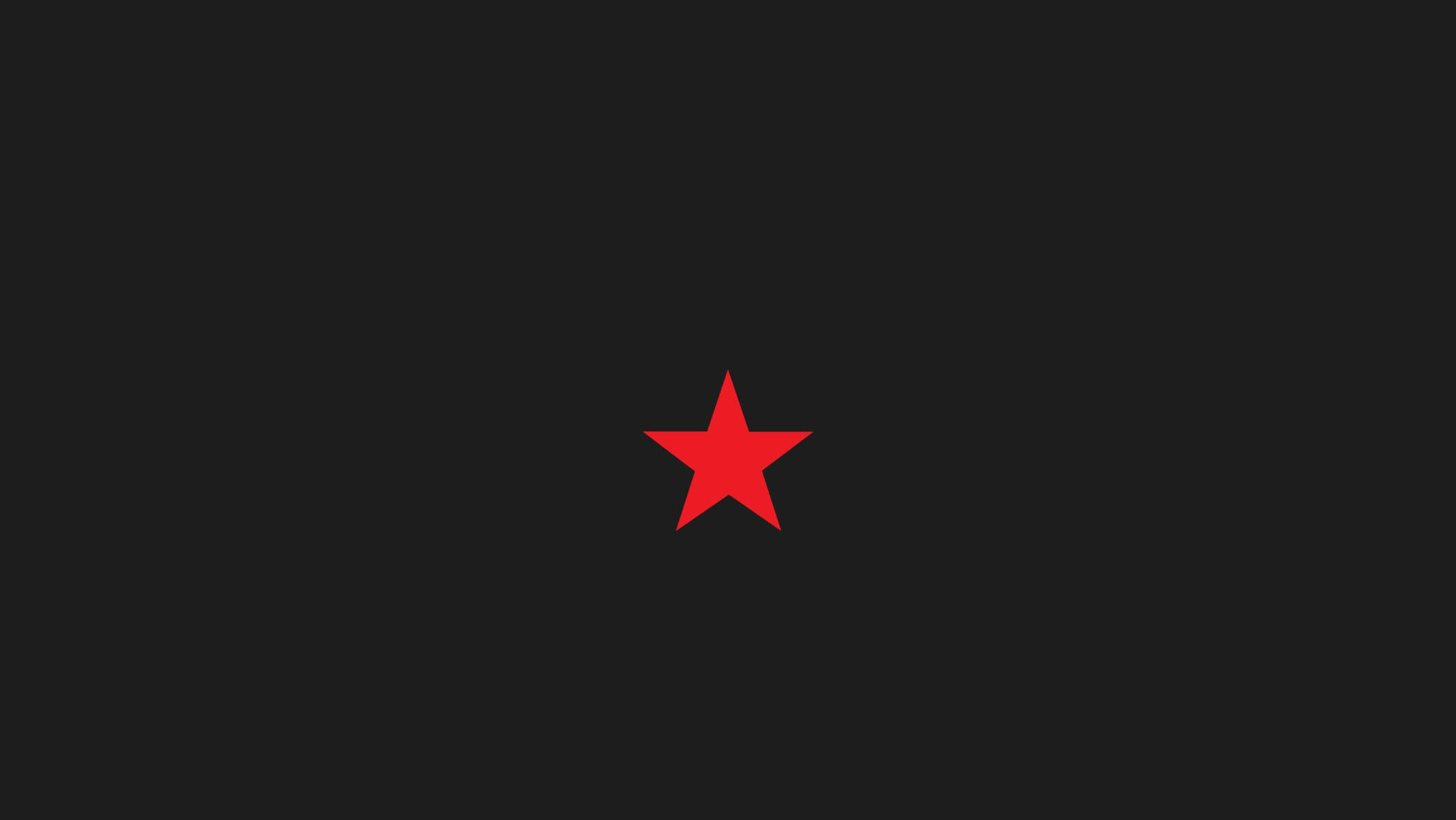 Red Star 桌布 壁紙 — 一個大膽的紅色五角星位於純黑色背景中央，營造出簡約而引人注目的視覺對比。