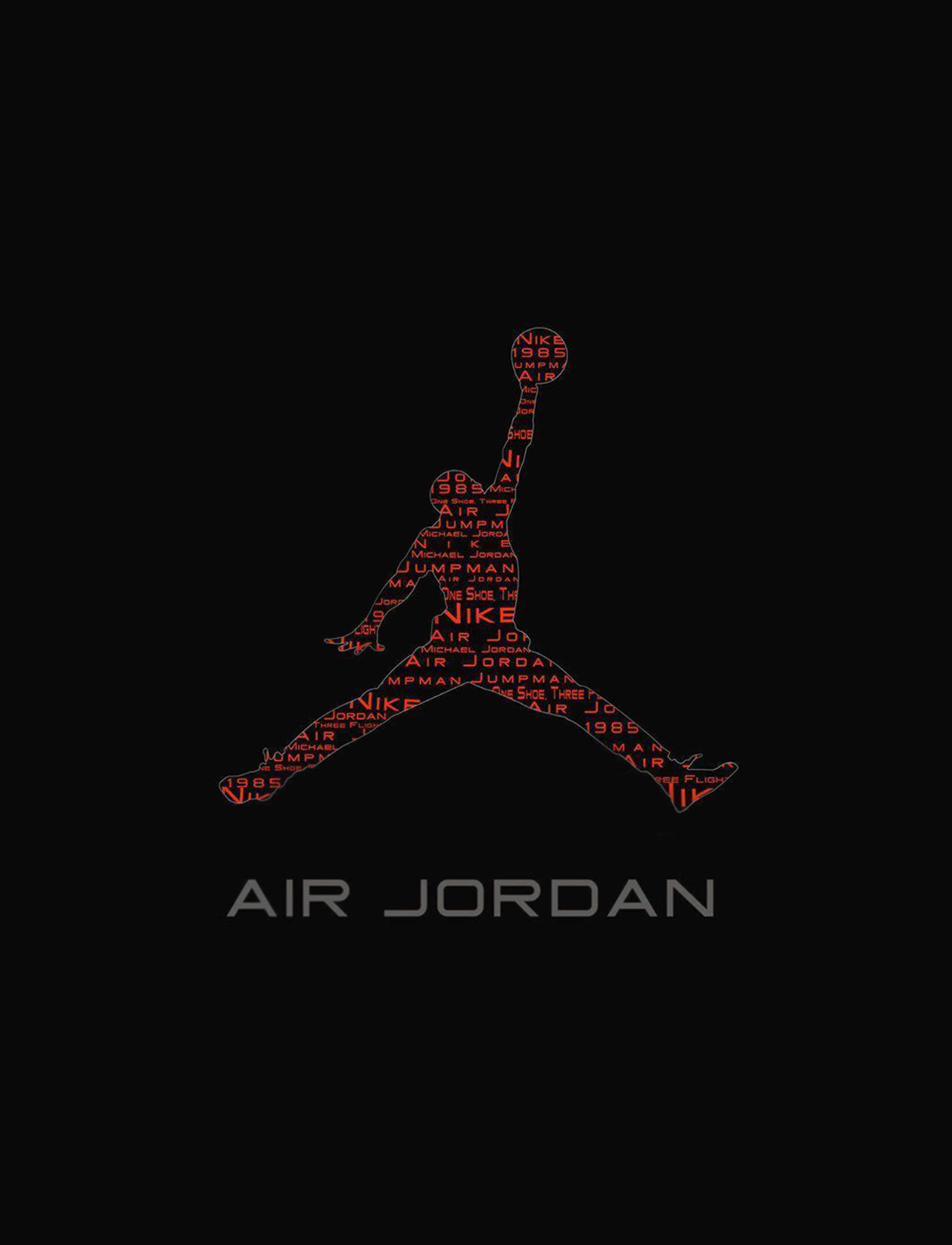 Air Jordan 桌布 壁紙 — 一個大膽的紅色剪影，由重複的文字如「AIR JORDAN」和「NIKE」在黑色背景上形成一個空中籃球運動員。