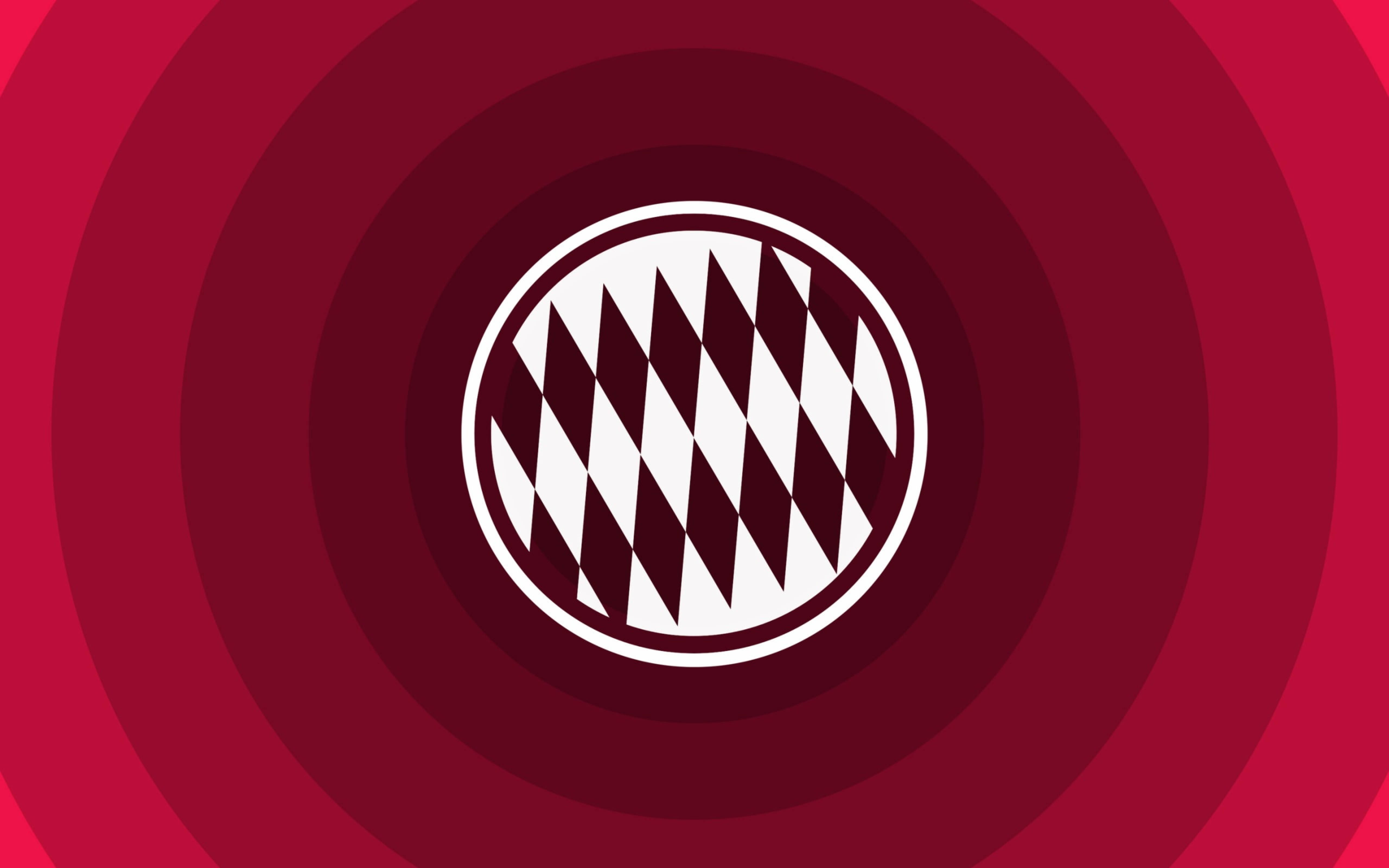 Bayern 桌布 壁紙 — 一個大膽的紅色同心圓背景框住一個白色圓圈，內含一個黑白菱形圖案標誌。