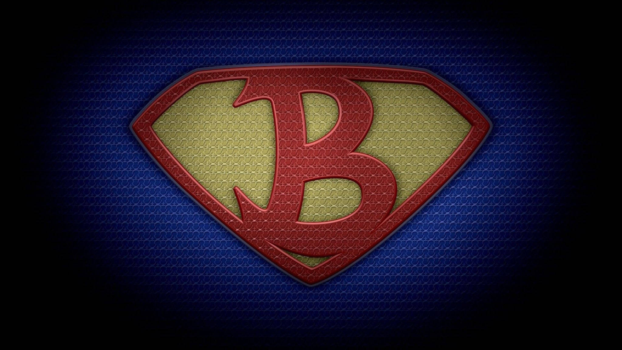 字母B 桌布 壁紙 — 一個大膽的紅色和金色「B」標誌，以超人盾牌形狀，在帶有紋理的藍色布料背景上發光。