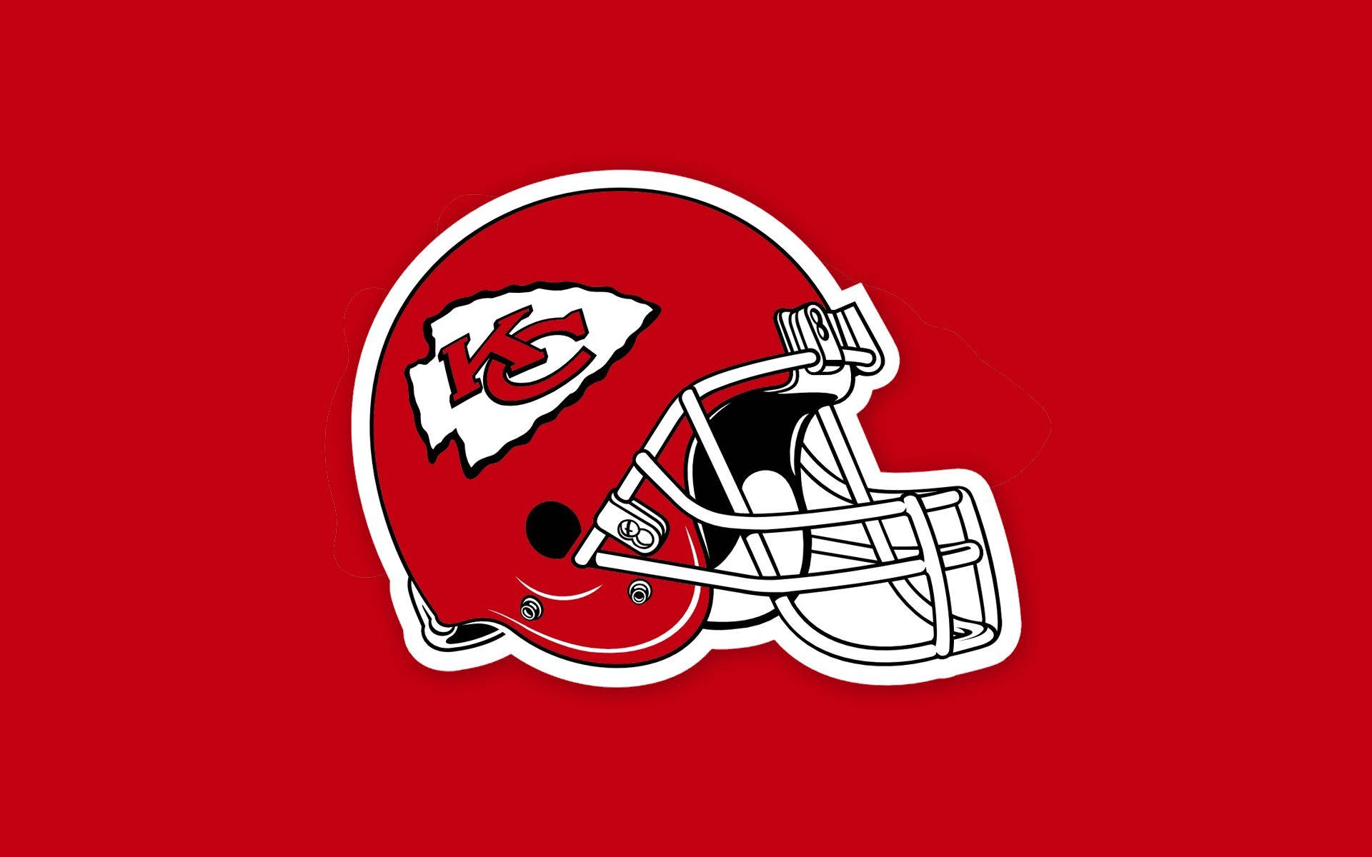 Kc Chiefs 桌布 壁紙 — 一個大膽的紅色堪薩斯城酋長隊美式足球頭盔，帶有白色和黑色細節，在純紅色背景上脫穎而出。