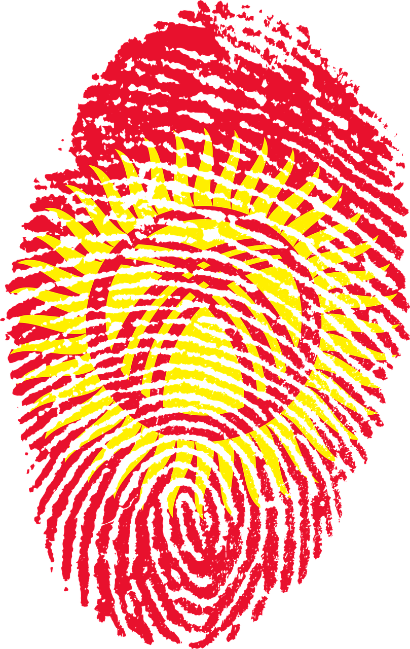 Fingerprint 桌布 壁紙 — 一個大膽的紅色指紋覆蓋在吉爾吉斯國旗的太陽和皇冠符號上，背景為純黑色。
