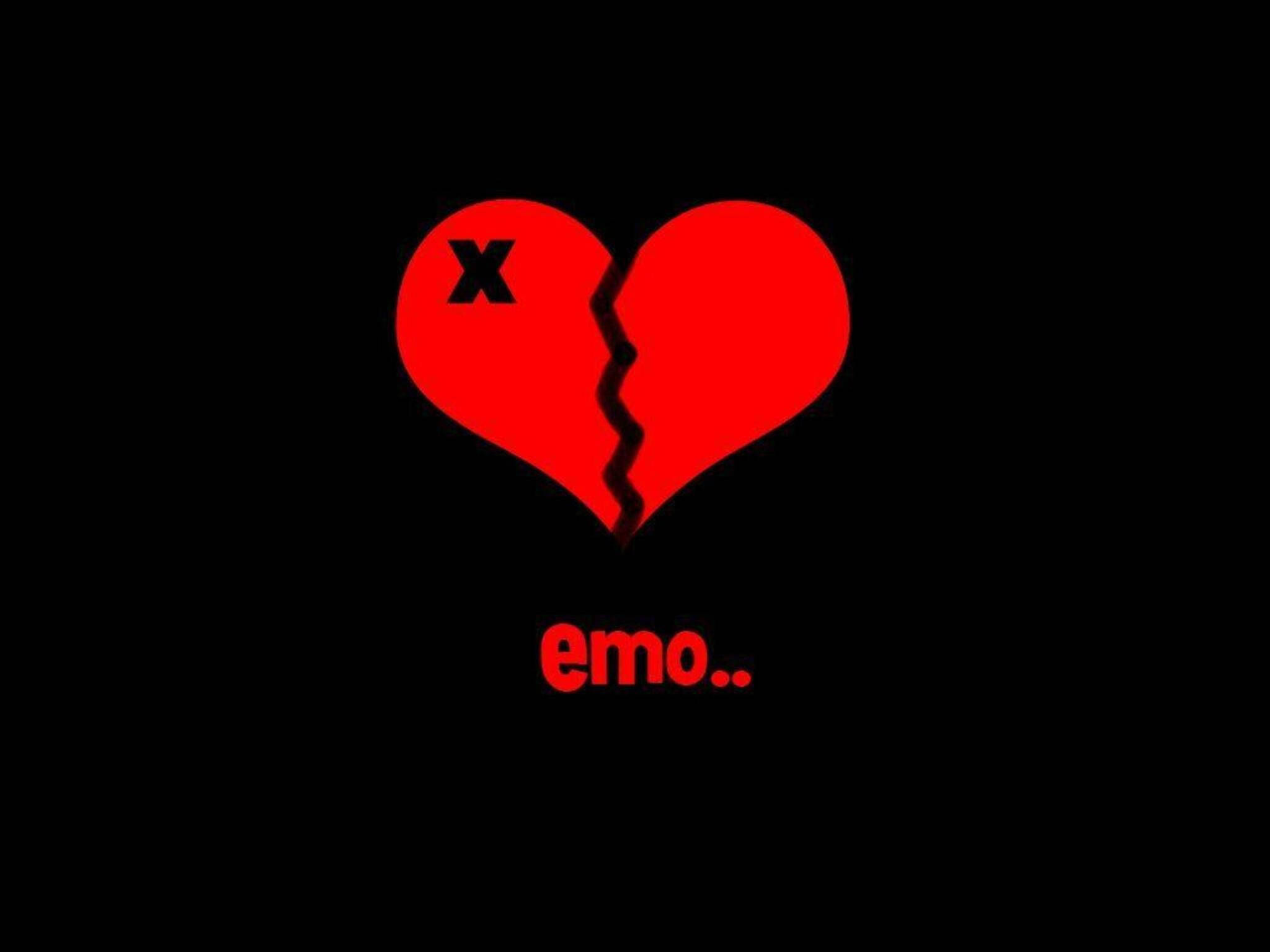 emo 桌布 壁紙 — 一個大膽的紅色破碎心臟，一半有X，下方有emo字樣，鮮明地置於黑色背景上。
