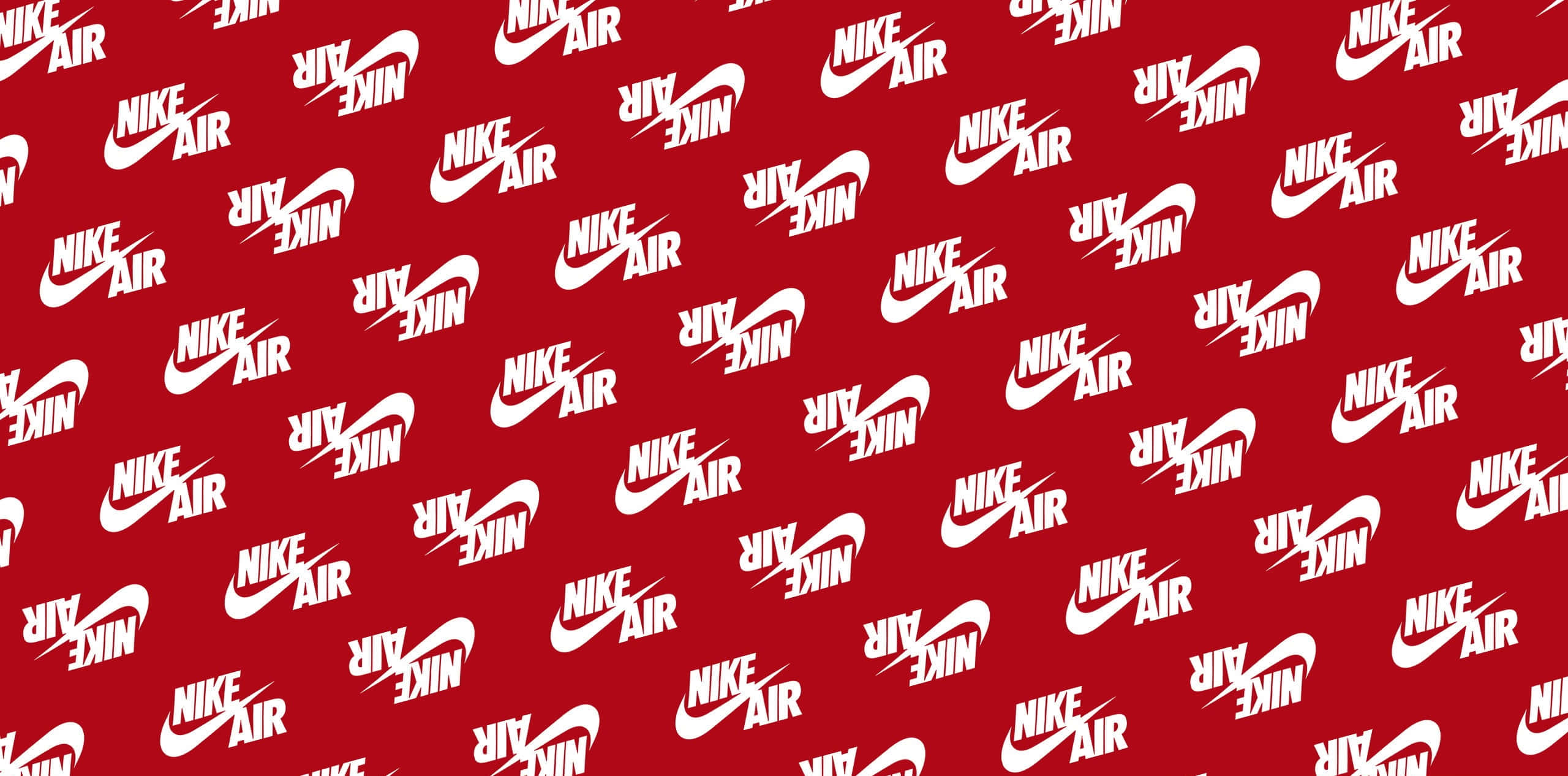 Red Nike 桌布 壁紙 — 一個大膽的紅色背景，充滿重複的白色Nike Air標誌，呈現動態散佈的圖案。