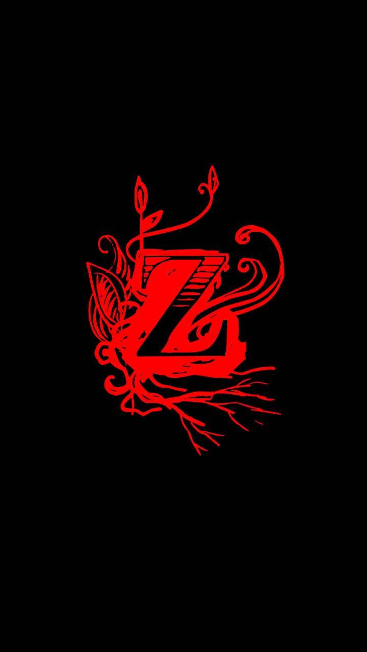 Z 桌布 壁紙 — 一個大膽的紅色風格化字母Z，飾以纏繞的藤蔓和葉子，襯以純黑背景。
