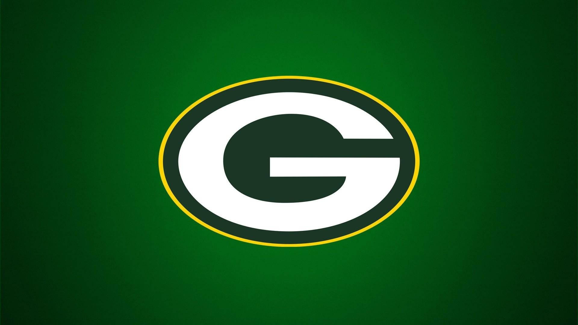 NFL Teams 桌布 壁紙 — 一個大膽的綠色和黃色橢圓形標誌，白色 'G' 居中在純綠色背景上。