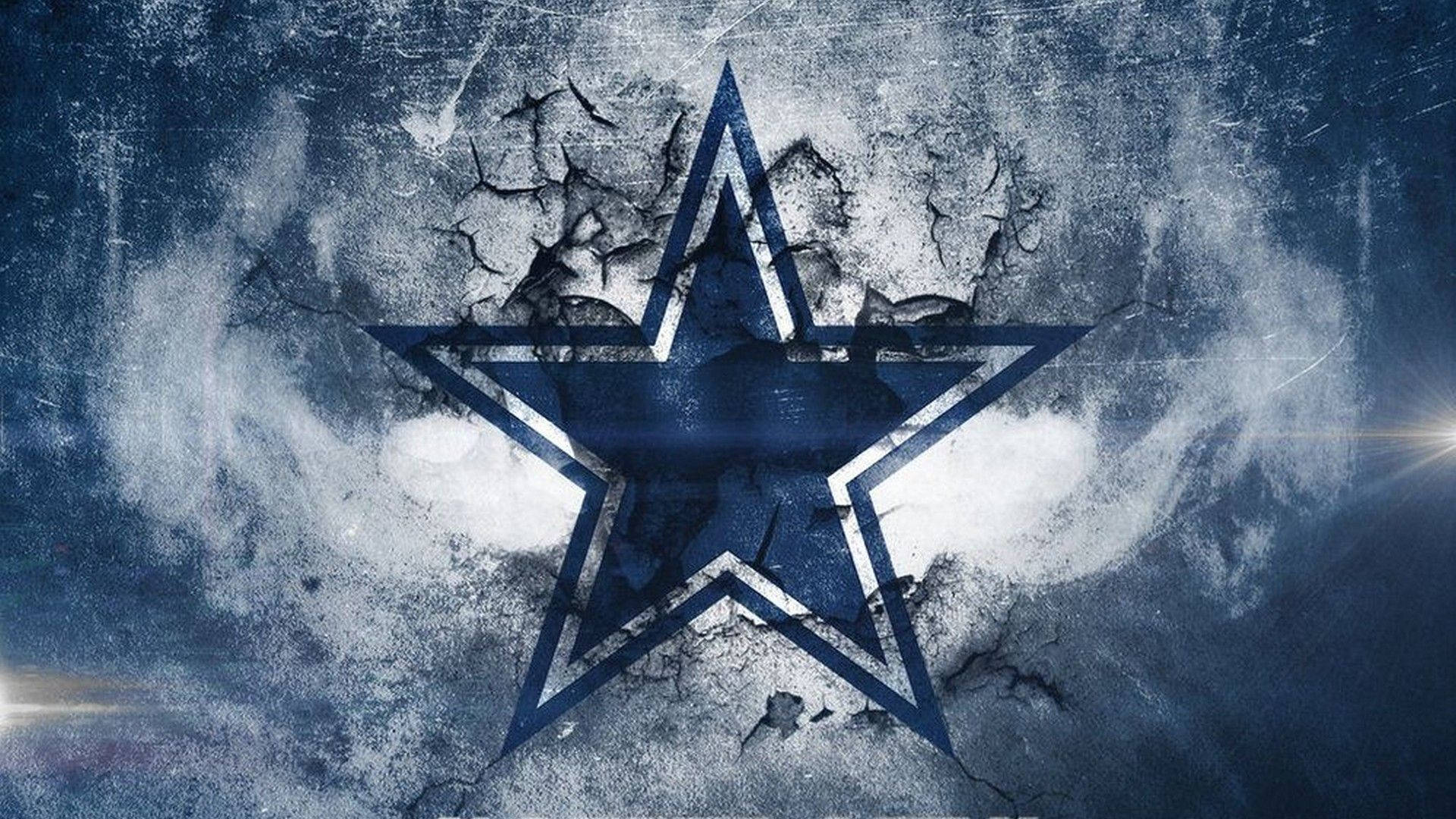 Dallas Stars 桌布 壁紙 — 一個大膽的藍色星星標誌穿過裂開的混凝土，帶有發光的閃光，背景是粗糙的紋理。
