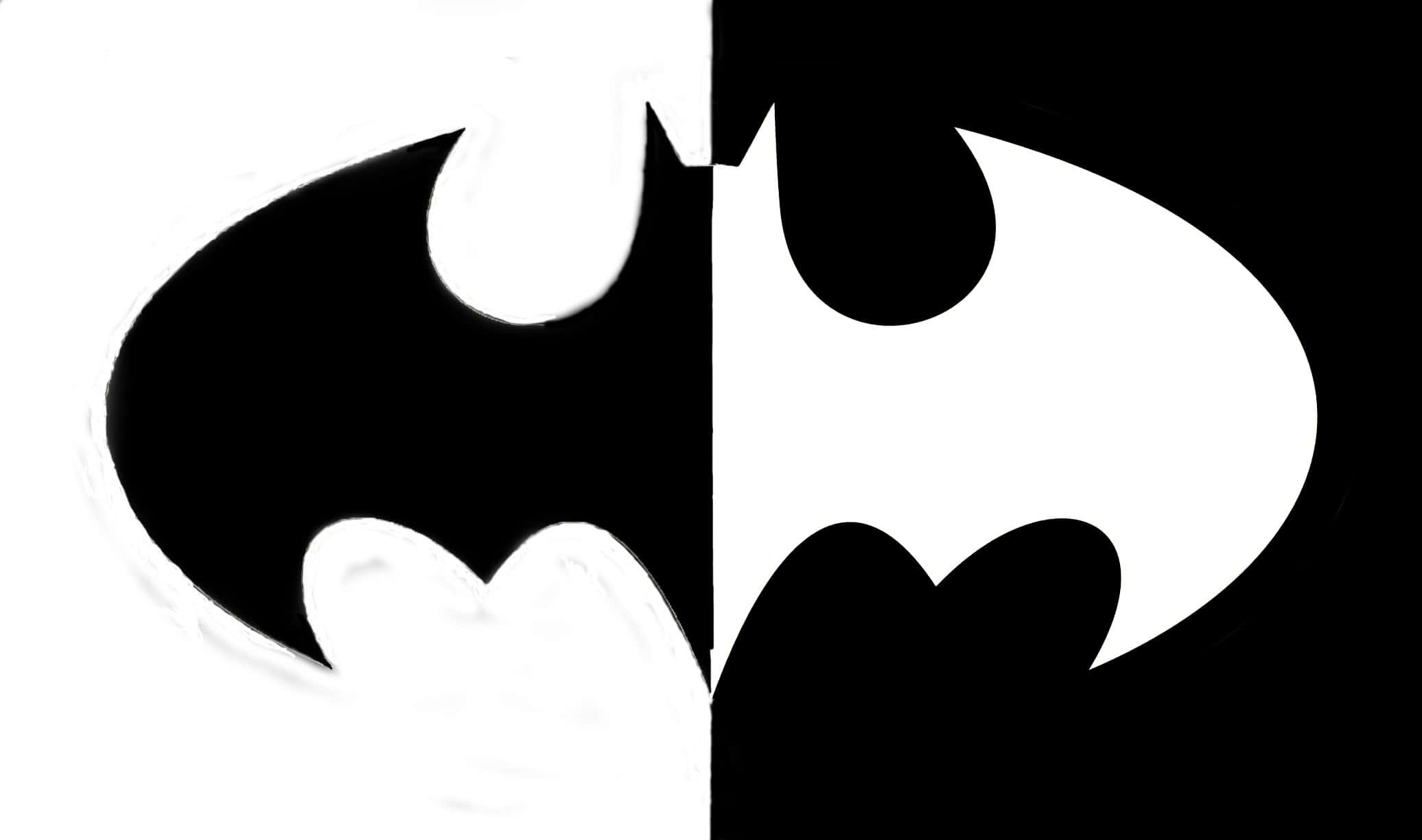 Batman Black And White 桌布 壁紙 — 一個大膽的蝙蝠標誌從中間一分為二，一半是白底黑色，另一半是黑底白色。