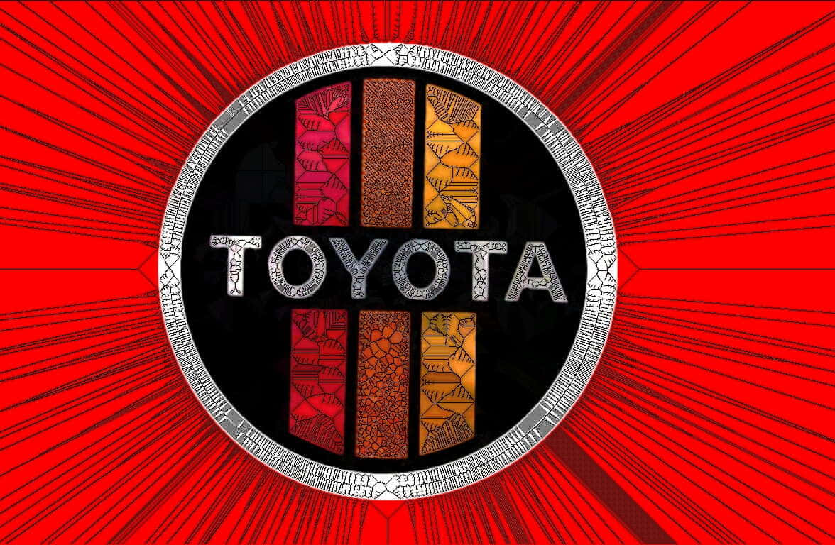 豐田標誌，在紅色放射背景上帶有彩色圖案面板。 — Toyota Supra Mk4 壁紙