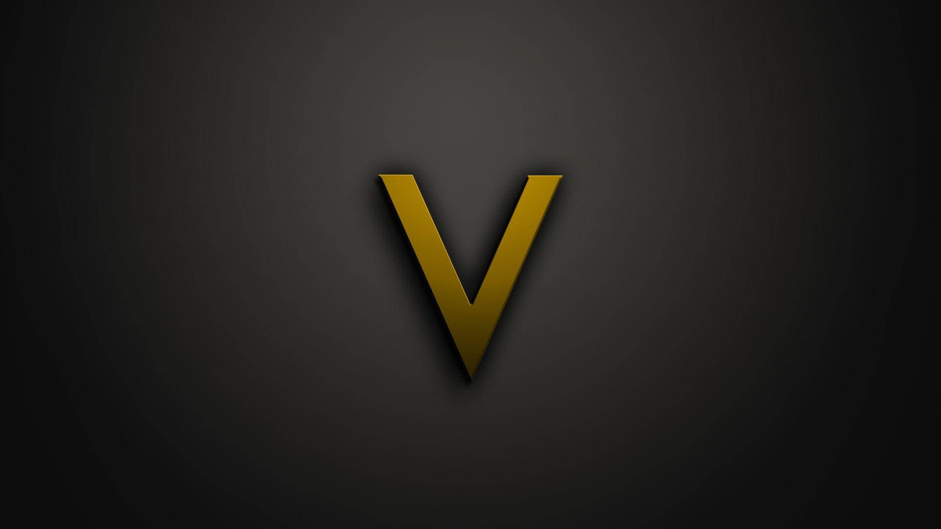 v 桌布 壁紙 — 一個大膽的金色字母 V 居中放置在帶有柔和照明的深色漸變背景上。