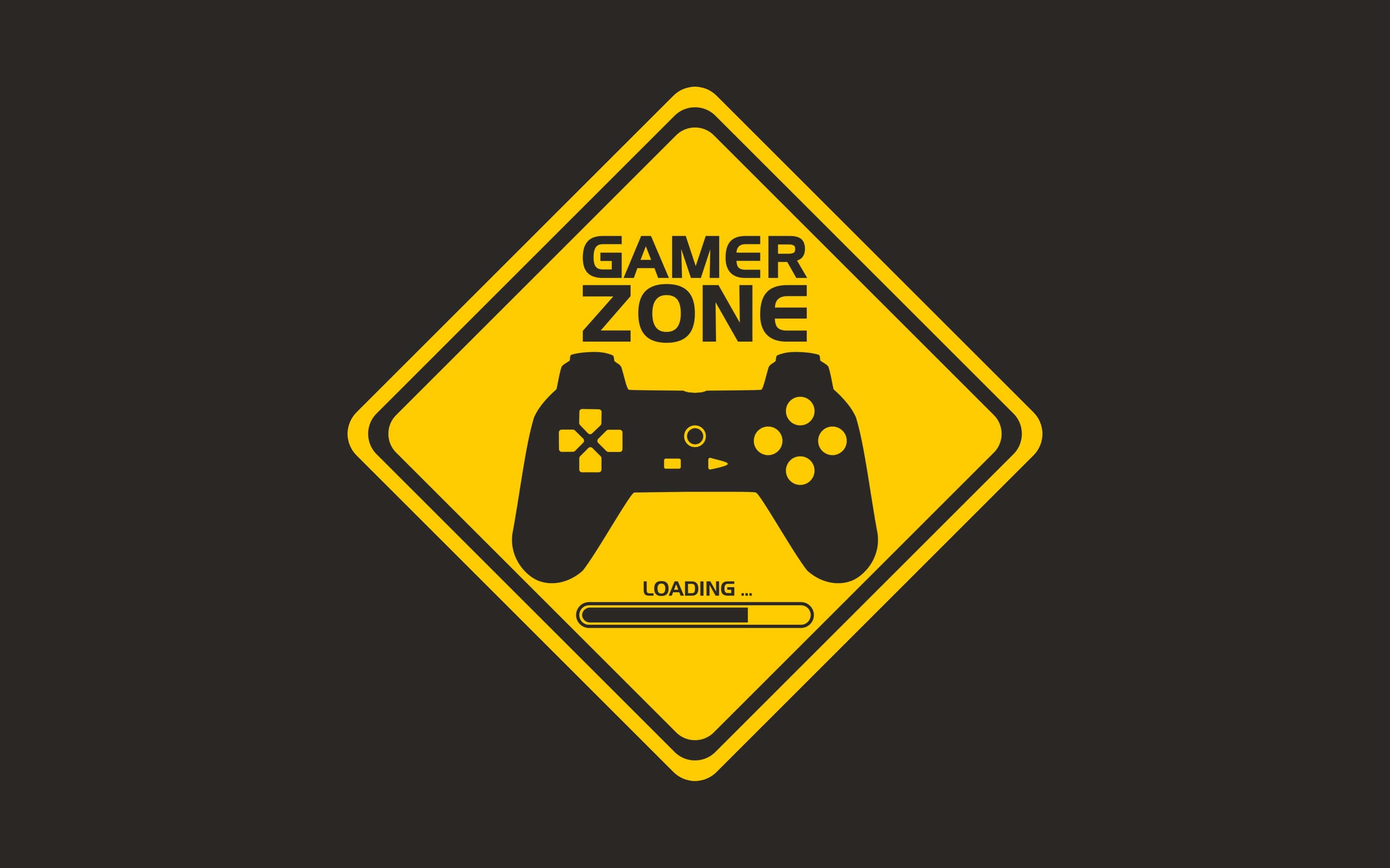 Pro Gamer 桌布 壁紙 — 一個大膽的黃色菱形道路標誌，在深色背景上宣告「GAMER ZONE」，帶有黑色遊戲控制器和載入條。