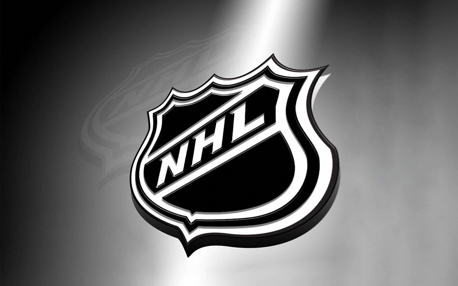 運動 桌布 壁紙 — 一個大膽的黑白NHL標誌在聚光燈下於灰色漸變背景上閃耀。