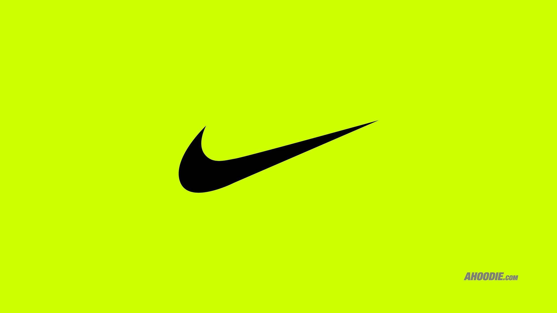 Nike 桌布 壁紙 — 一個大膽的黑色Nike swoosh標誌，居中放在充滿活力的萊姆綠色背景上。