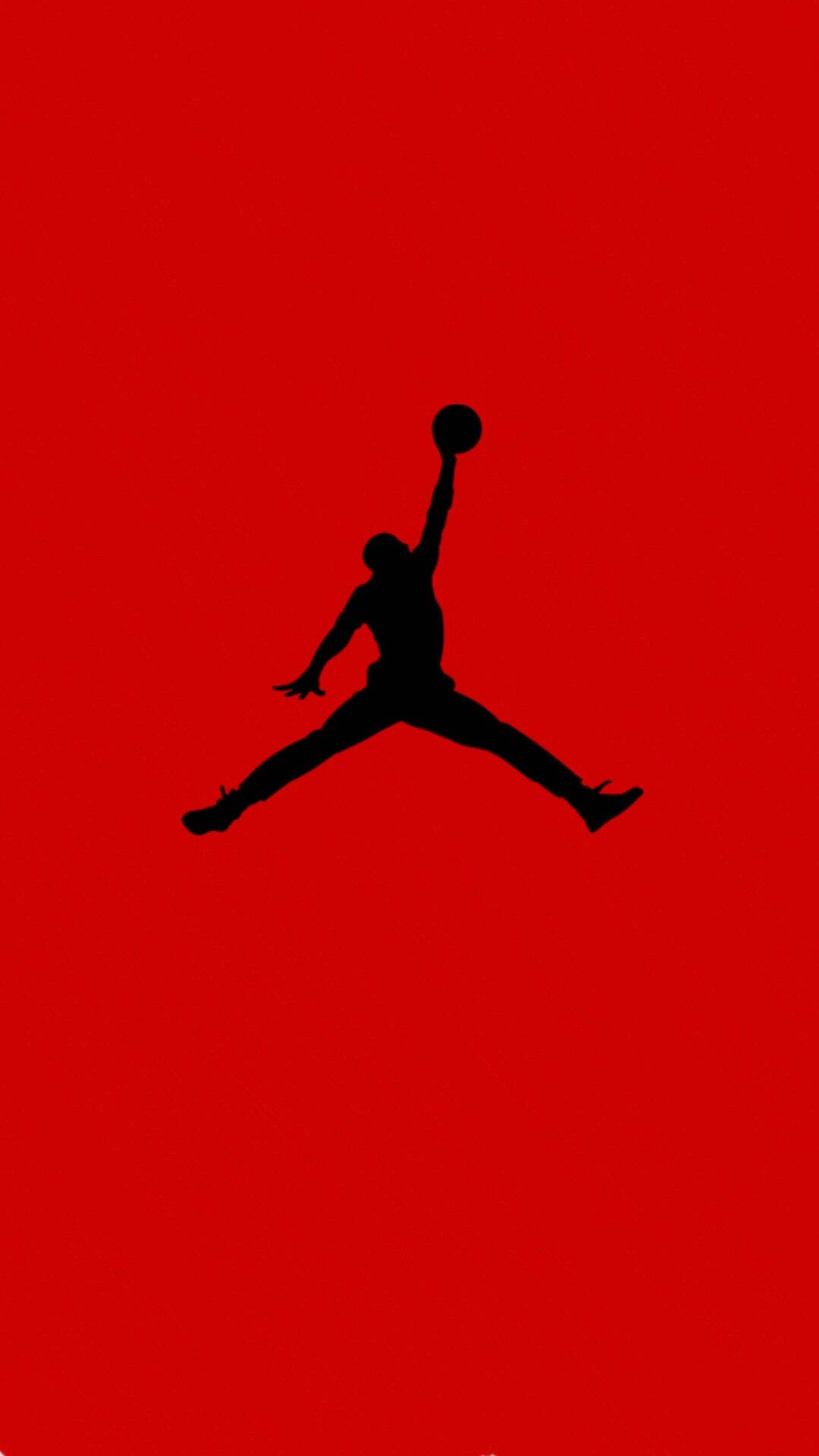 Jordan Logo 桌布 壁紙 — 一個大膽的黑色剪影，描繪籃球運動員在半空中灌籃，背景為純紅色。