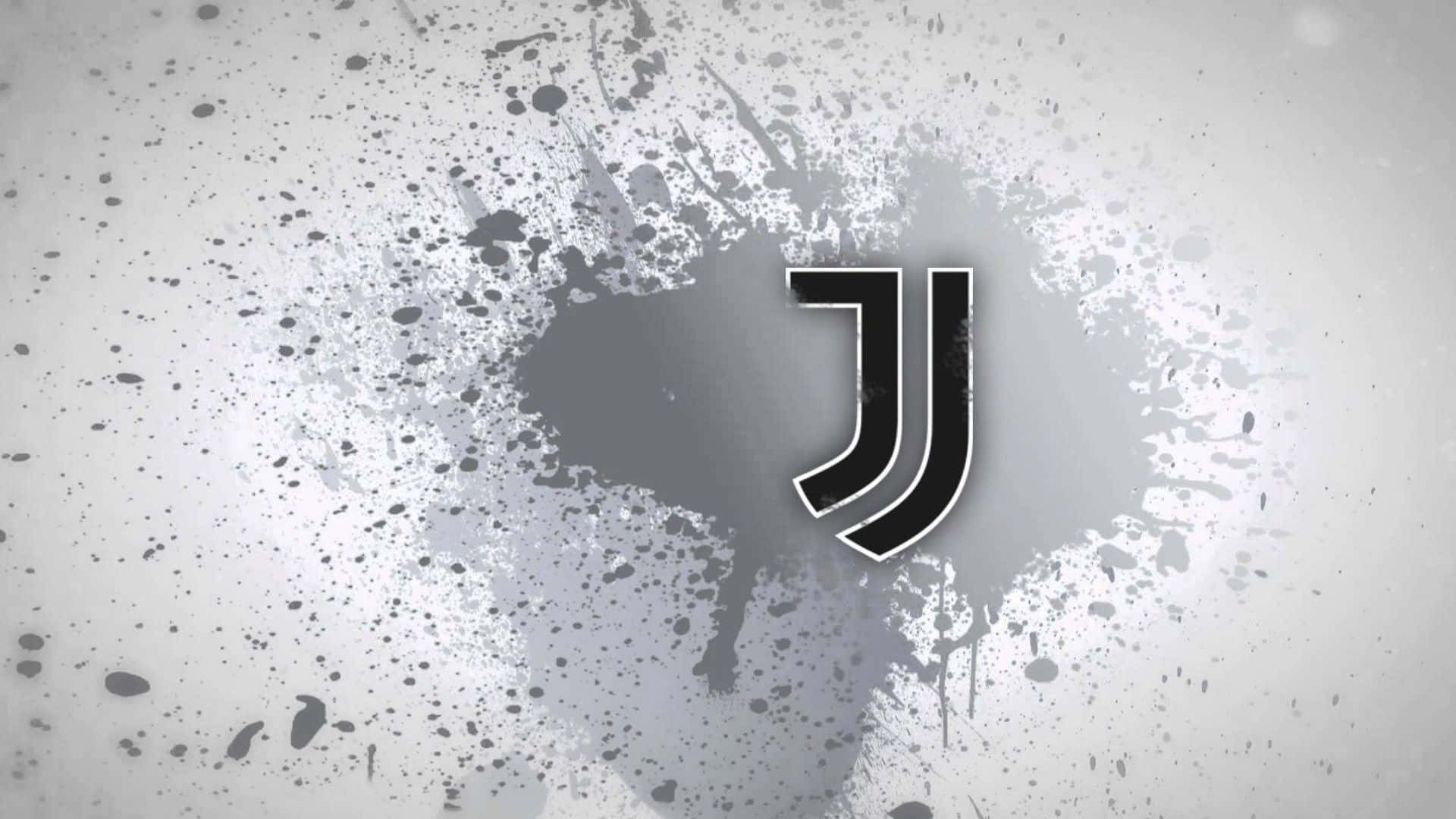 Juventus 桌布 壁紙 — 一個大膽的黑色尤文圖斯標誌居中在帶有紋理的灰色背景上，並帶有墨水飛濺效果。