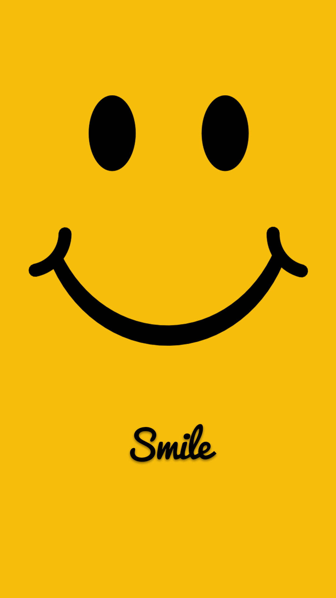 黃色 桌布 壁紙 — 一個大膽的黑色笑臉，中間帶有「smile」字樣，背景為鮮黃色。