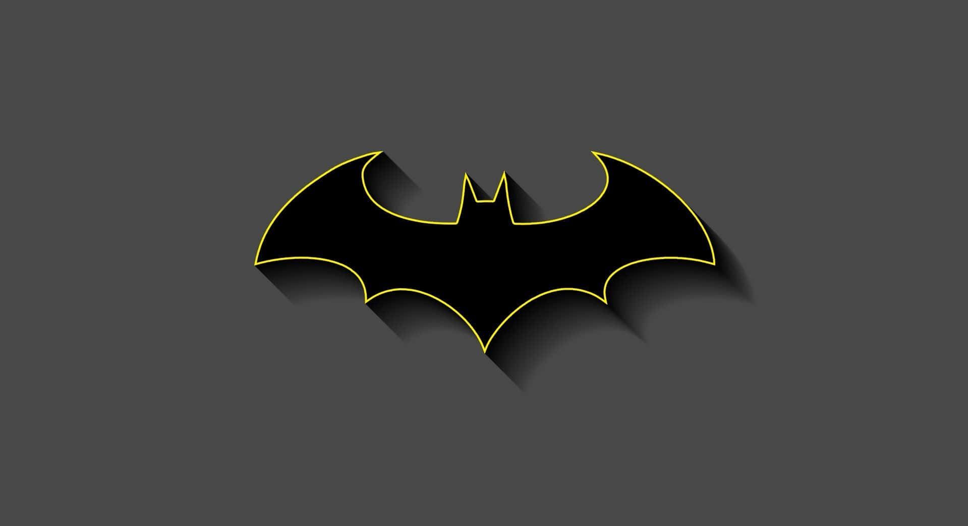 Batman Logo 桌布 壁紙 — 一個大膽的黑色蝙蝠標誌，帶有發光的黃色輪廓，在深灰色背景上投下長長的陰影。