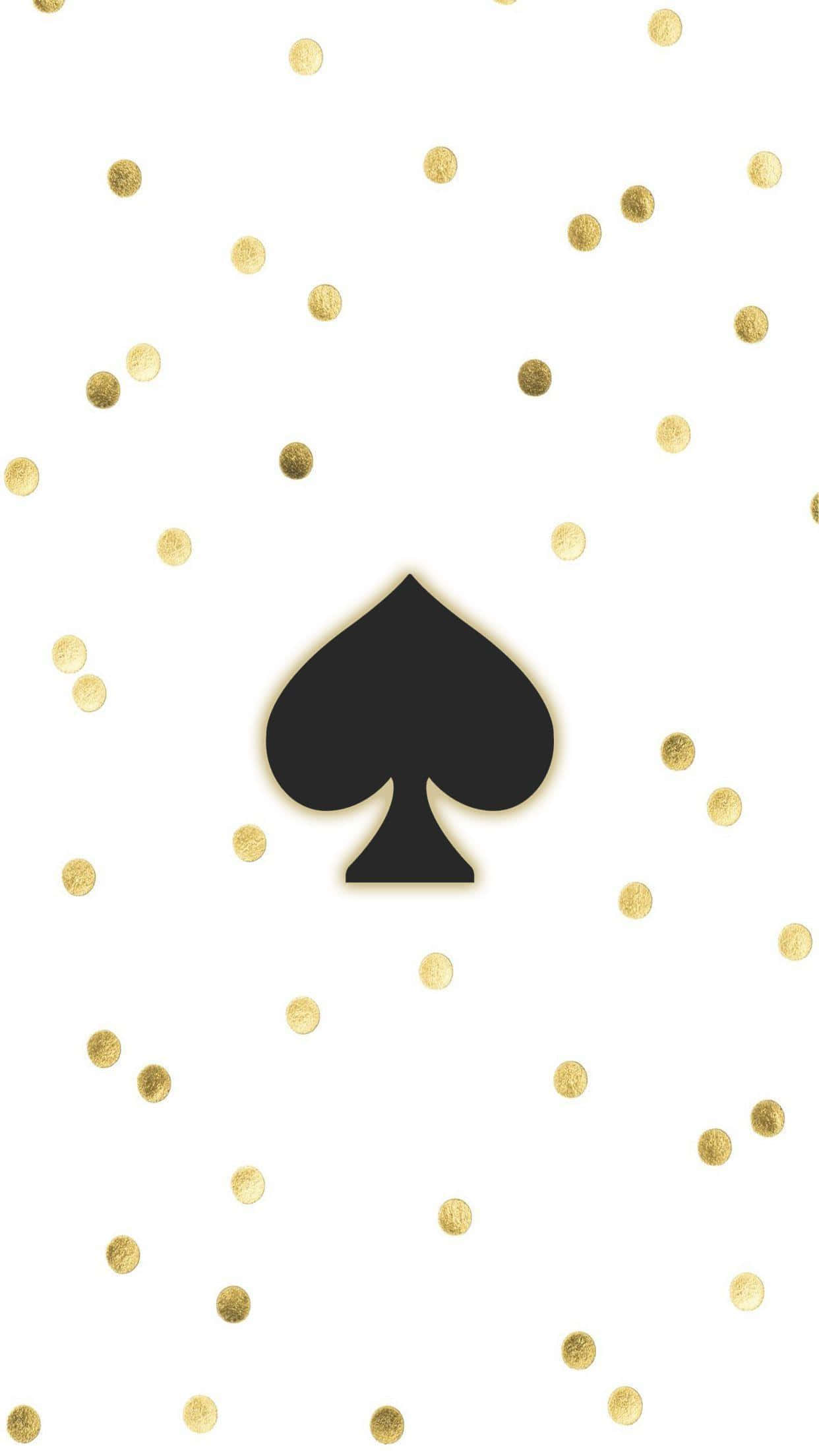 kate spade 桌布 壁紙 — 一個大膽的黑色黑桃符號居中於白色背景上，並散落著金色紙屑點。