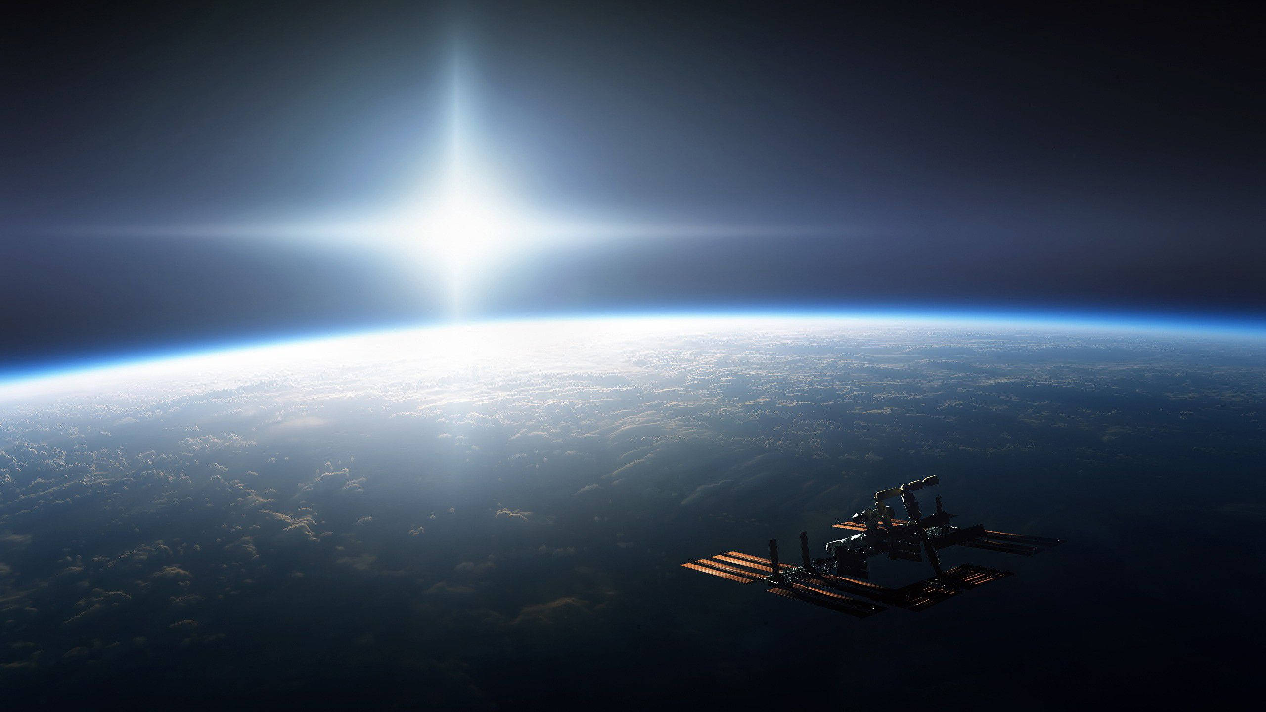 NASA 動態圖片 桌布 壁紙 — 一個太空站繞地球運行，太陽在行星彎曲的地平線上方明亮地照耀。