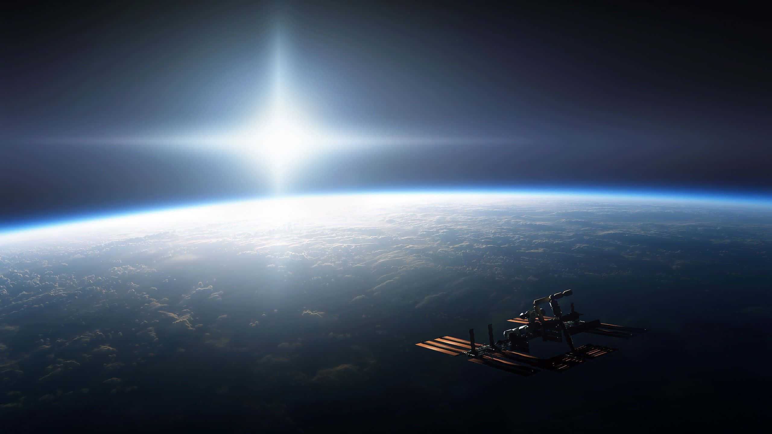 NASA 動態圖片 桌布 壁紙 — 一個太空站繞地球運行，太陽在行星彎曲的地平線上方明亮地照耀。