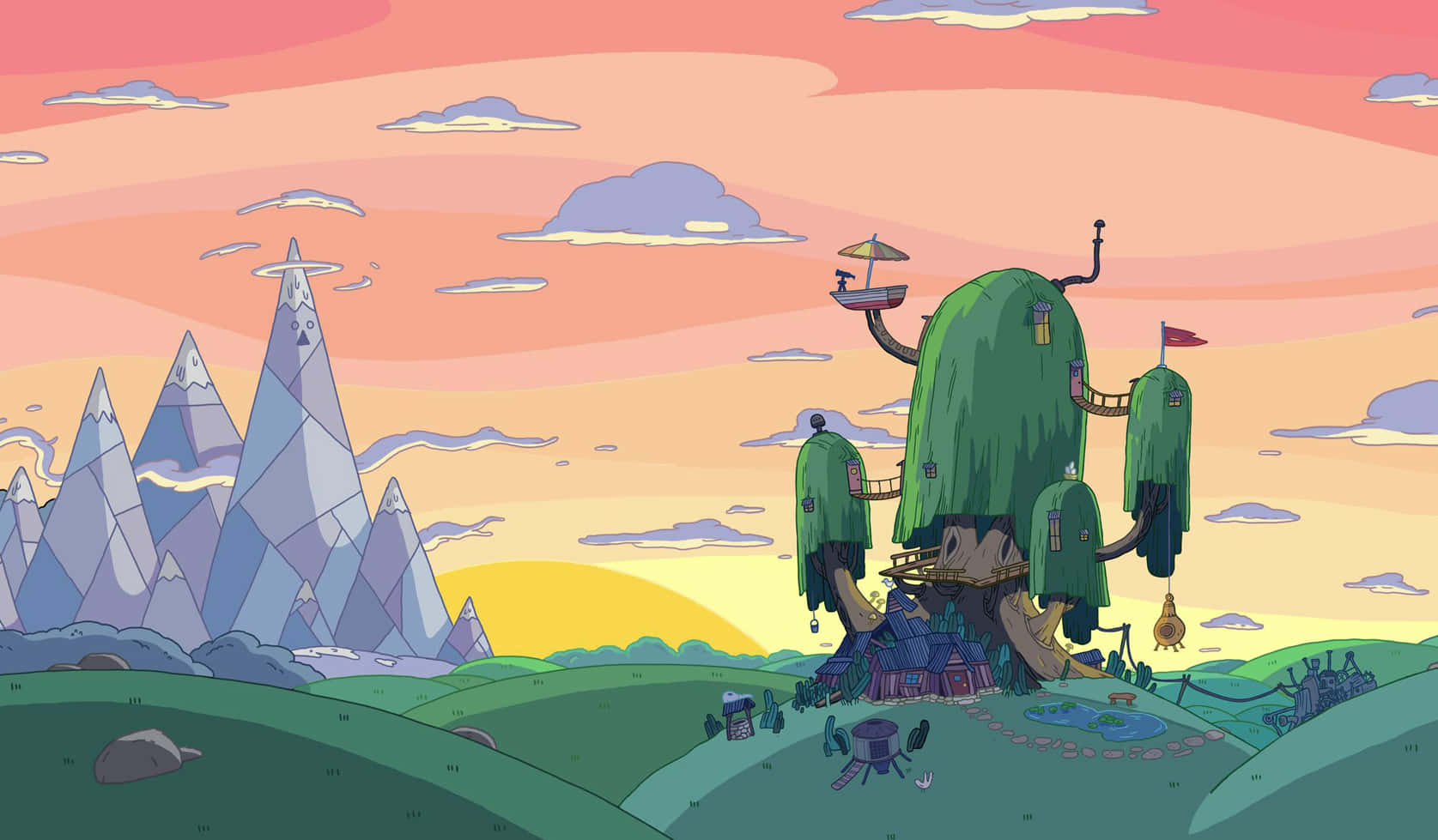 Adventure Time Cute 桌布 壁紙 — 一個奇幻的樹屋村莊坐落在日落時分的山丘上，背景是鋸齒狀的山脈。