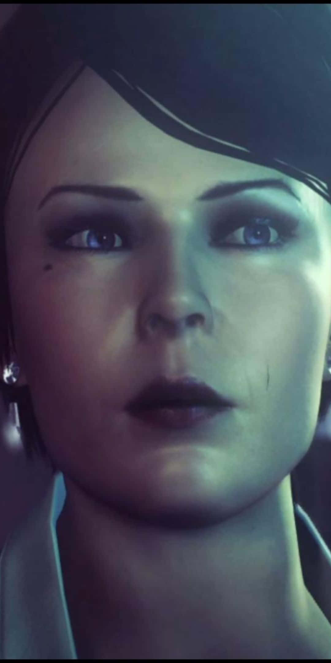 Pixel 3 Hitman Absolution 桌布 壁紙 — 一個女人臉部的特寫，短黑髮，在冷藍色燈光下有一雙強烈的藍眼睛。