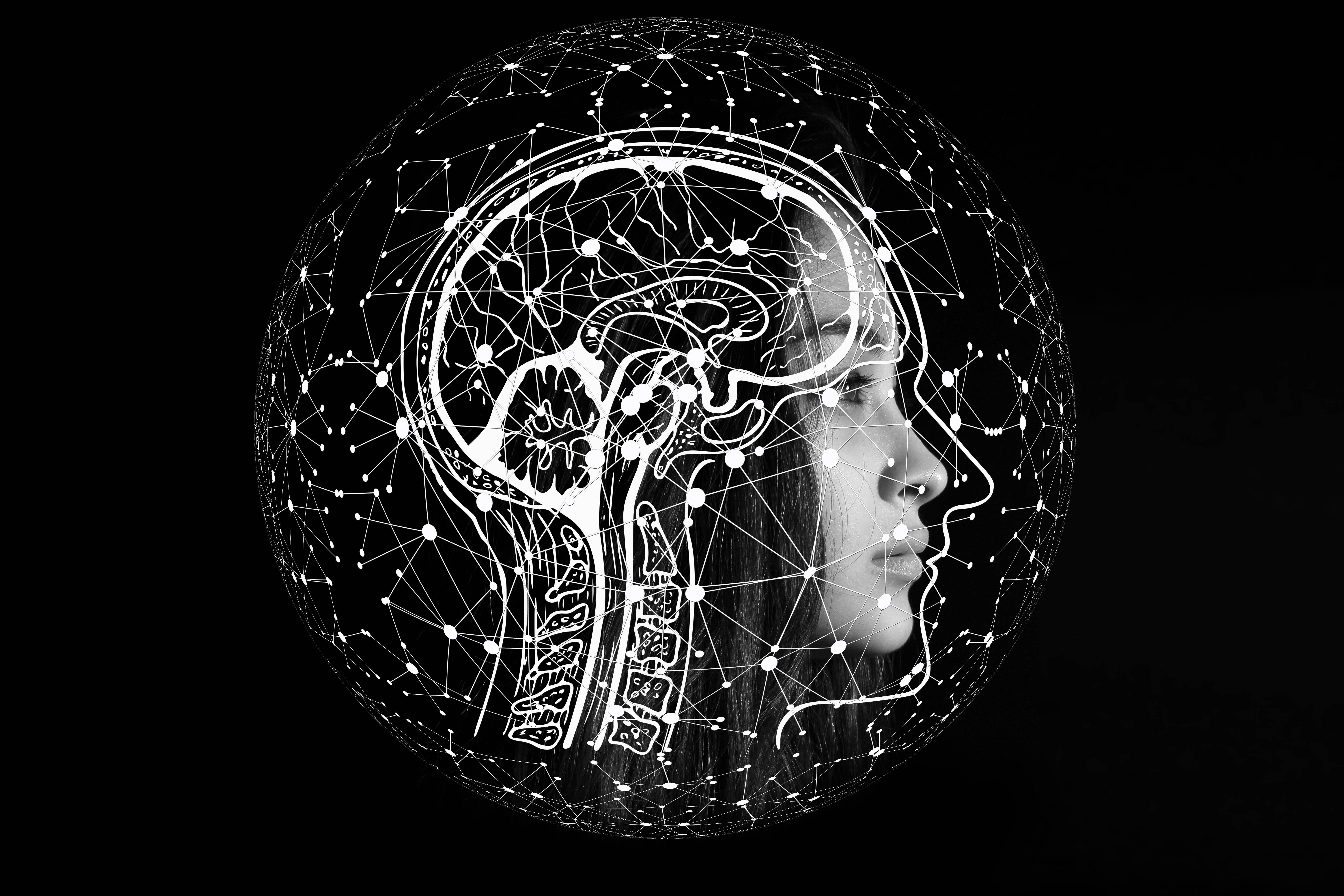 Woman 桌布 壁紙 — 一個女性側面輪廓被發光的白色神經網絡球體包裹，背景為黑色。