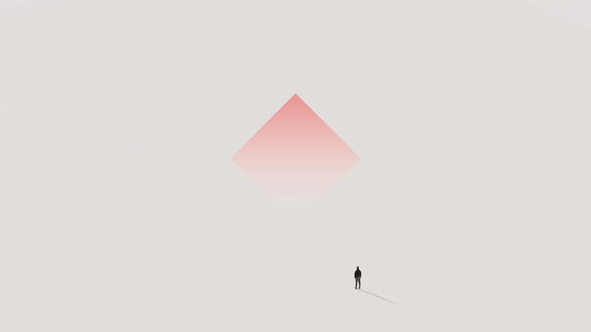 Beautiful Minimalist 桌布 壁紙 — 一個孤獨的剪影站在一個漂浮在極簡灰色虛空中的大型粉紅色鑽石下方。