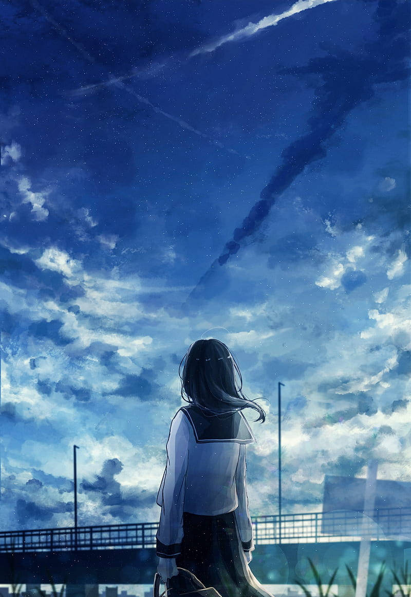Cool Android 桌布 壁紙 — 一個孤獨的動漫女孩穿著校服，仰望廣闊的星空，夜空中有宇宙雲和發光的流星軌跡。