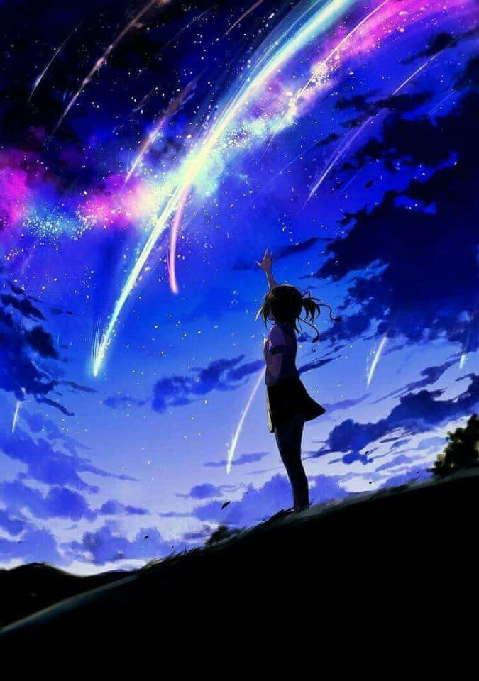 動漫 桌布 壁紙 — 一個孤獨的動漫女孩站在山丘上，向著充滿色彩繽紛流星和閃爍星星的充滿活力的宇宙天空伸出手。