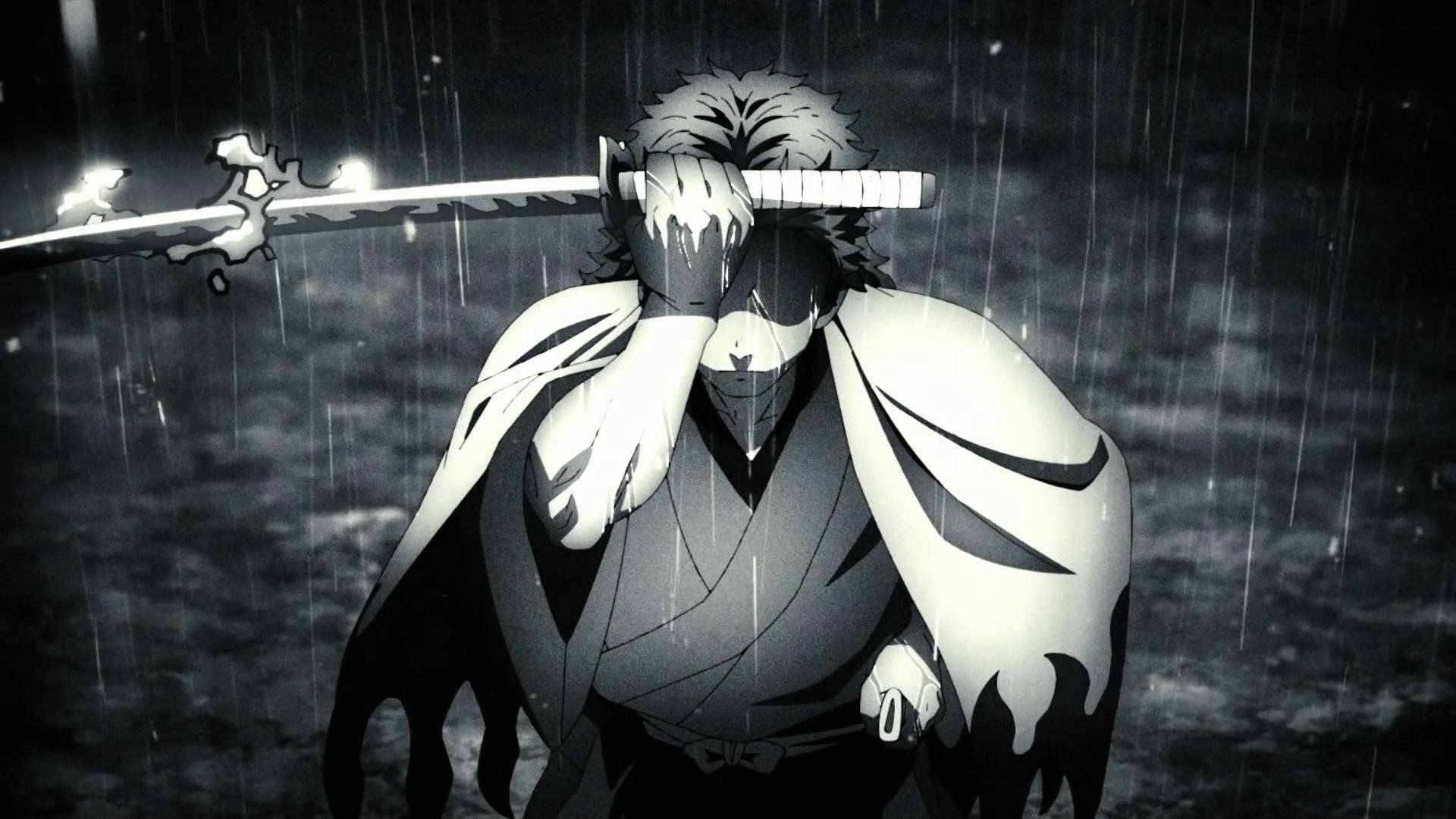 Demon Slayer Black And White 桌布 壁紙 — 一個孤獨的動漫戰士手持劍站立在傾盆大雨中，斗篷飄揚，臉龐被陰影和暴雨遮蓋。