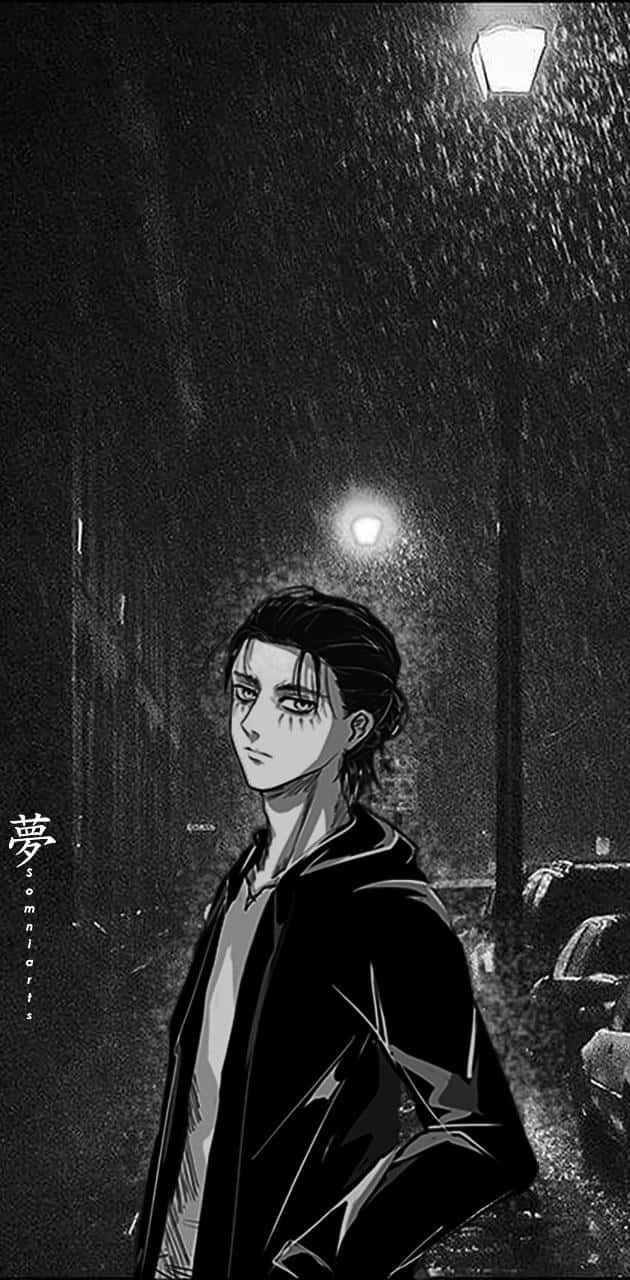 艾連·葉卡 桌布 壁紙 — 一個孤獨的動漫角色站在被雨水打濕的路燈下，身處陰鬱的黑白城市夜景中。