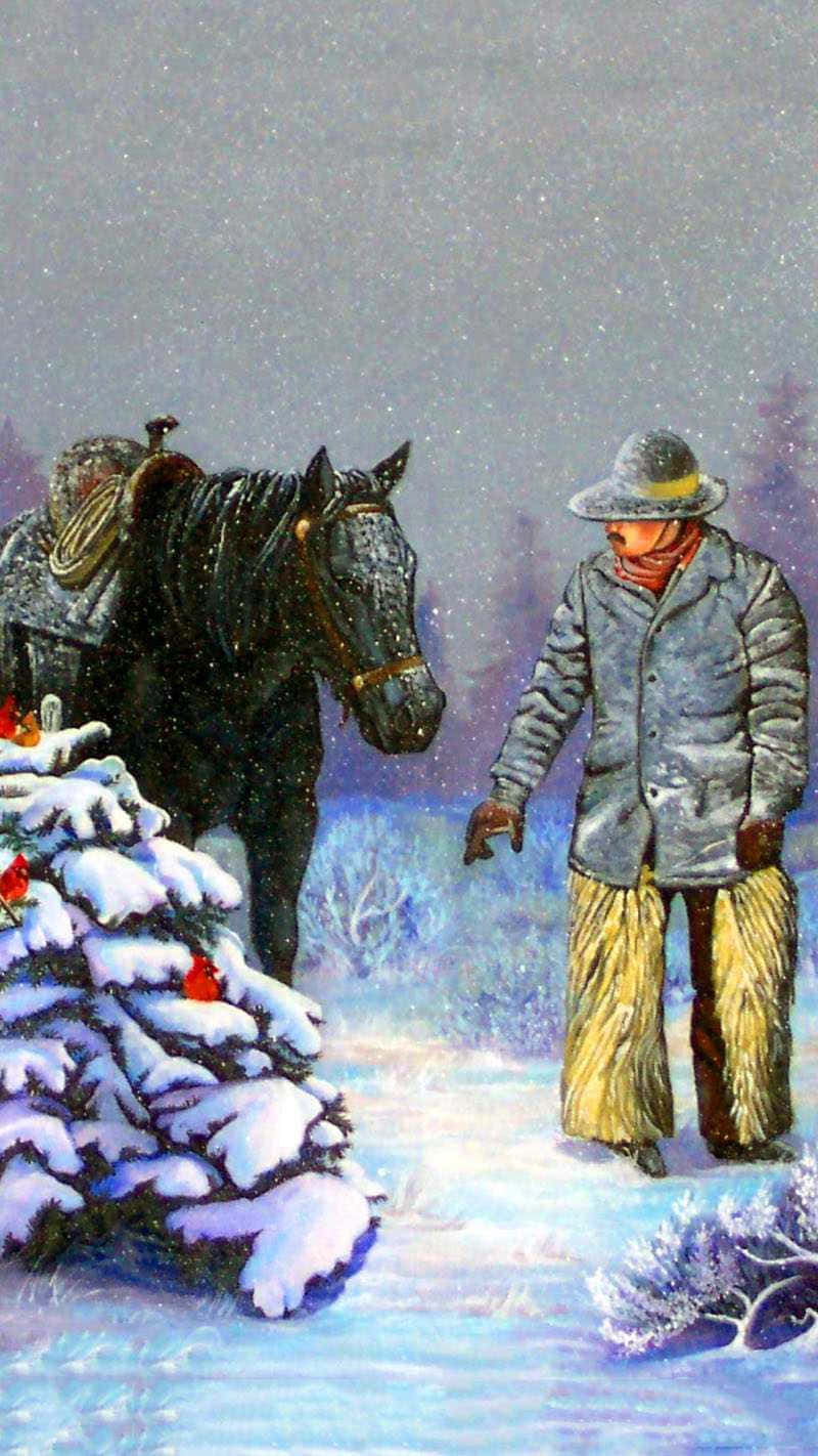 Cowboy Christmas 桌布 壁紙 — 一個孤獨的牛仔在暴風雪中站在他備好鞍的馬旁邊，靠近一棵掛滿雪和紅莓的灌木。