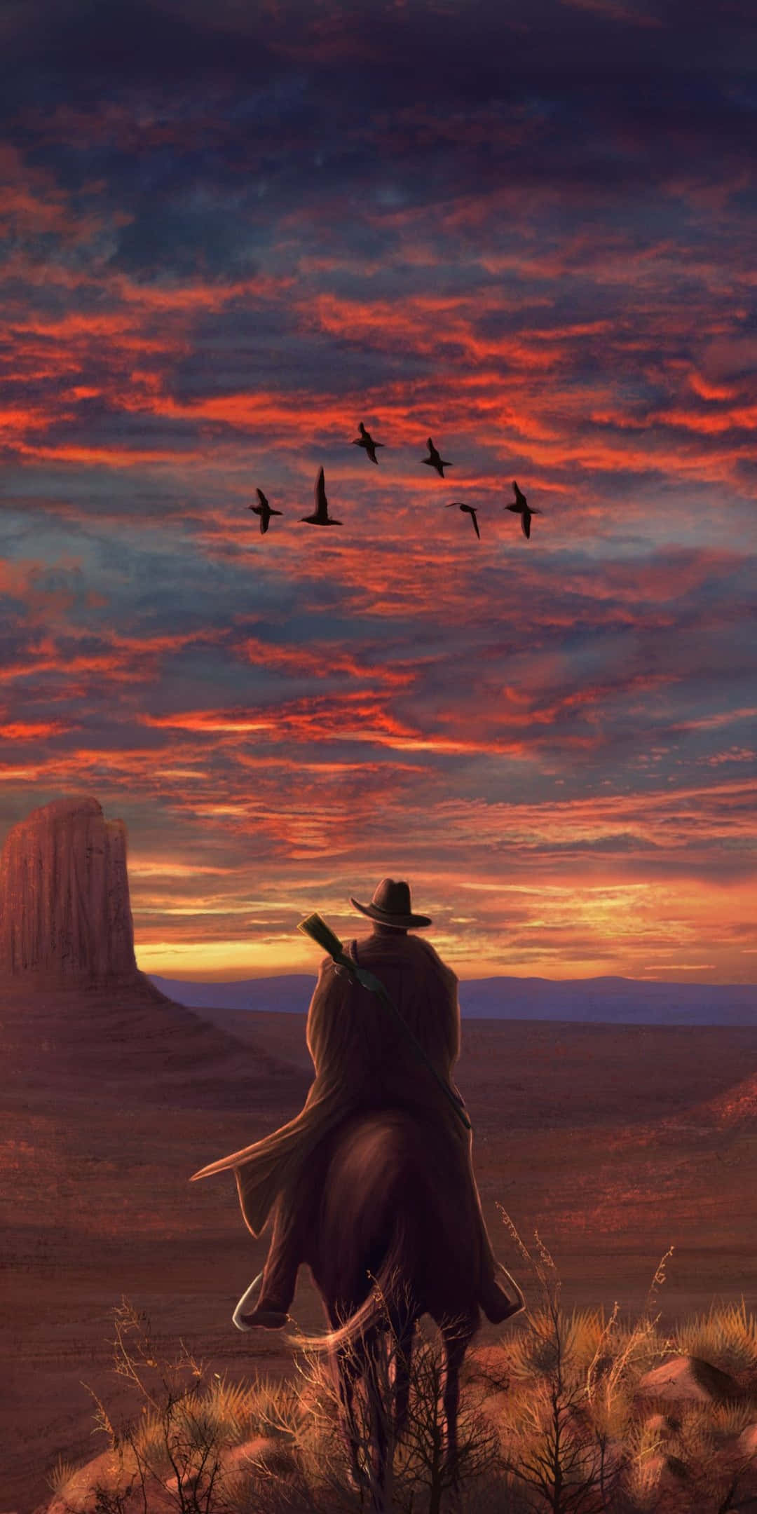 Red Dead Redemtion 2 桌布 壁紙 — 一個孤獨的牛仔騎在馬背上，凝視著熾熱的日落天空，鳥兒在沙漠峽谷上空飛翔。