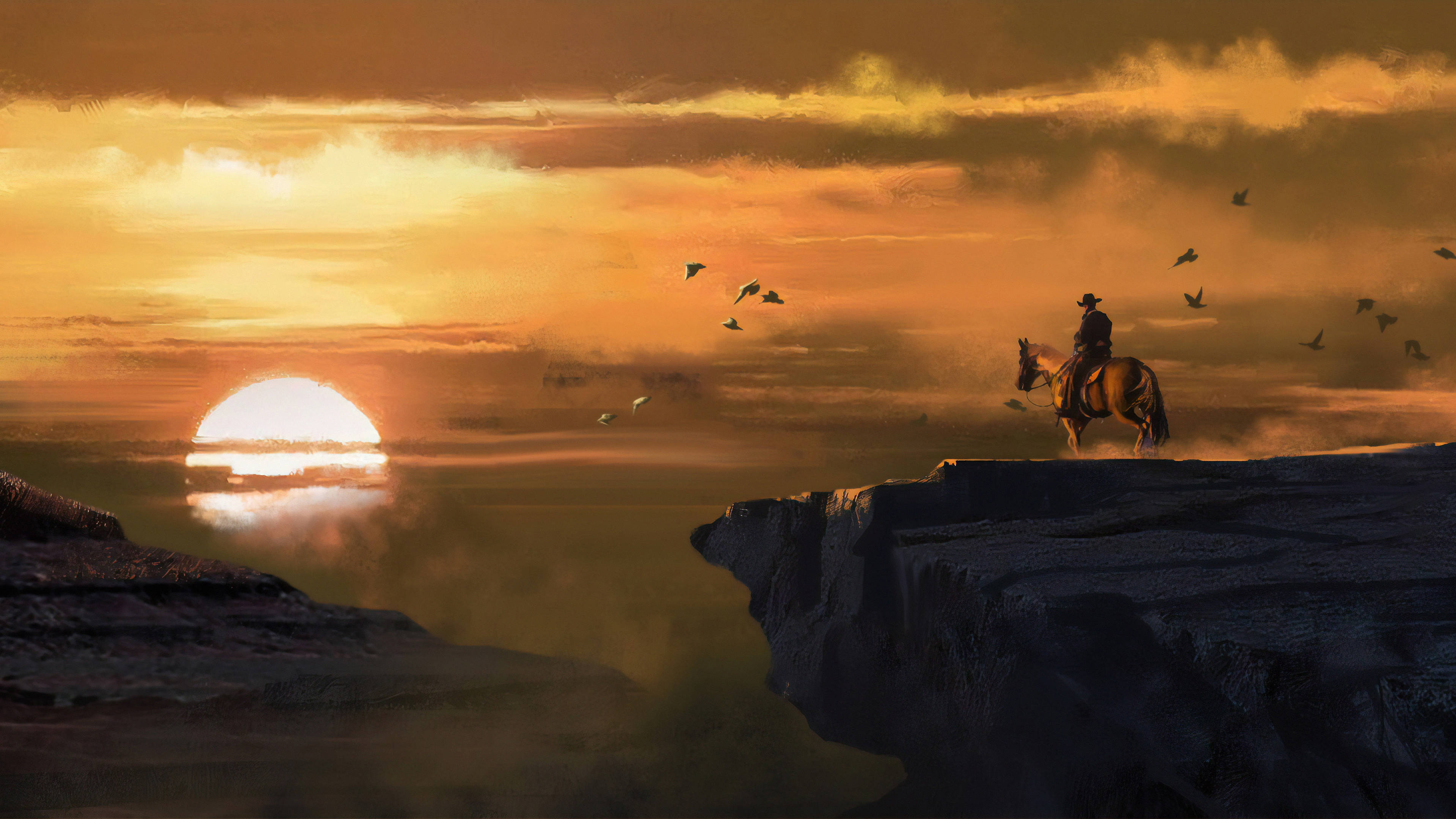 Red Dead Redemtion 2 桌布 壁紙 — 一個孤獨的牛仔騎在馬背上，站在日落時分的懸崖頂上，在鳥兒飛過頭頂的橙色天空襯托下形成剪影。