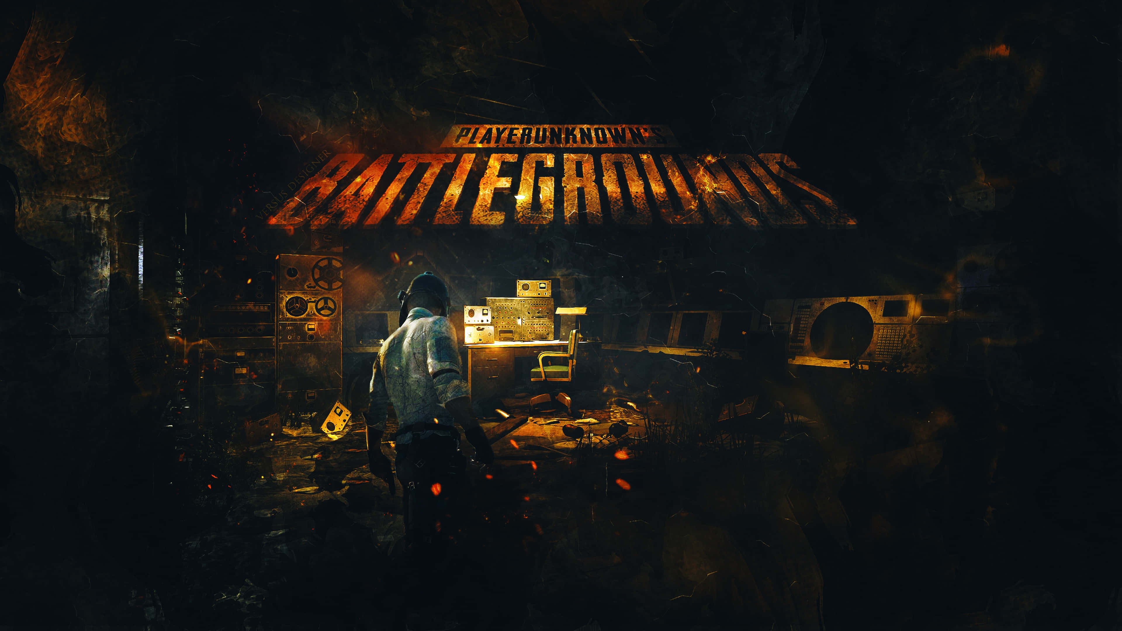 Playerunknowns Battleground Desktop 桌布 壁紙 — 一個孤獨的玩家在昏暗、佈滿碎片的掩體中，頭頂上閃爍著「PLAYERUNKNOWN'S BATTLEGROUNDS」的標誌。