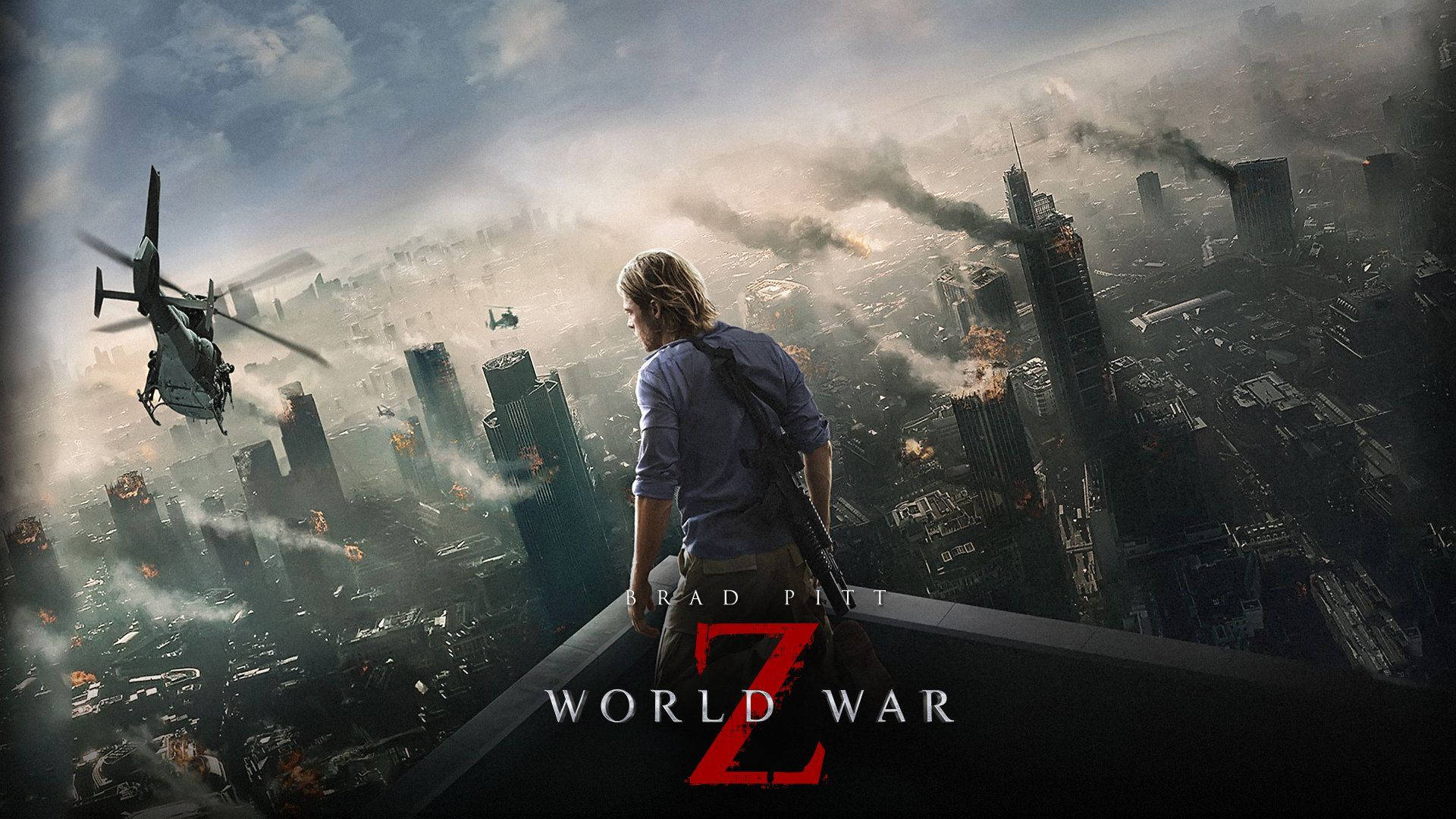 world war z 4K 桌布 壁紙 — 一個孤獨的男人站在屋頂上，俯瞰著陷入混亂的城市，直升機在燃燒的摩天大樓上空飛過，濃煙升騰到天空。