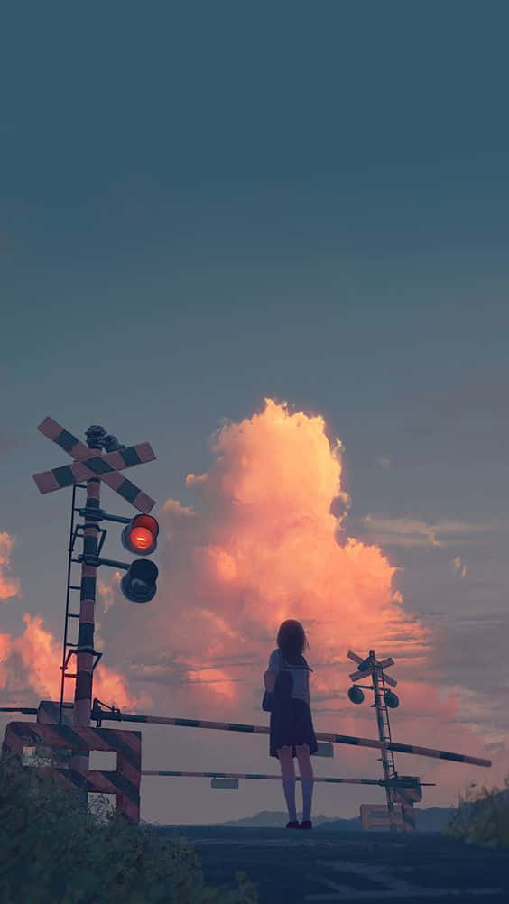 Anime Girl Aesthetic 桌布 壁紙 — 一個孤獨的穿著校服的女孩站在降下的鐵路平交道前，一團火橙色的雲在暮色天空中爆發。