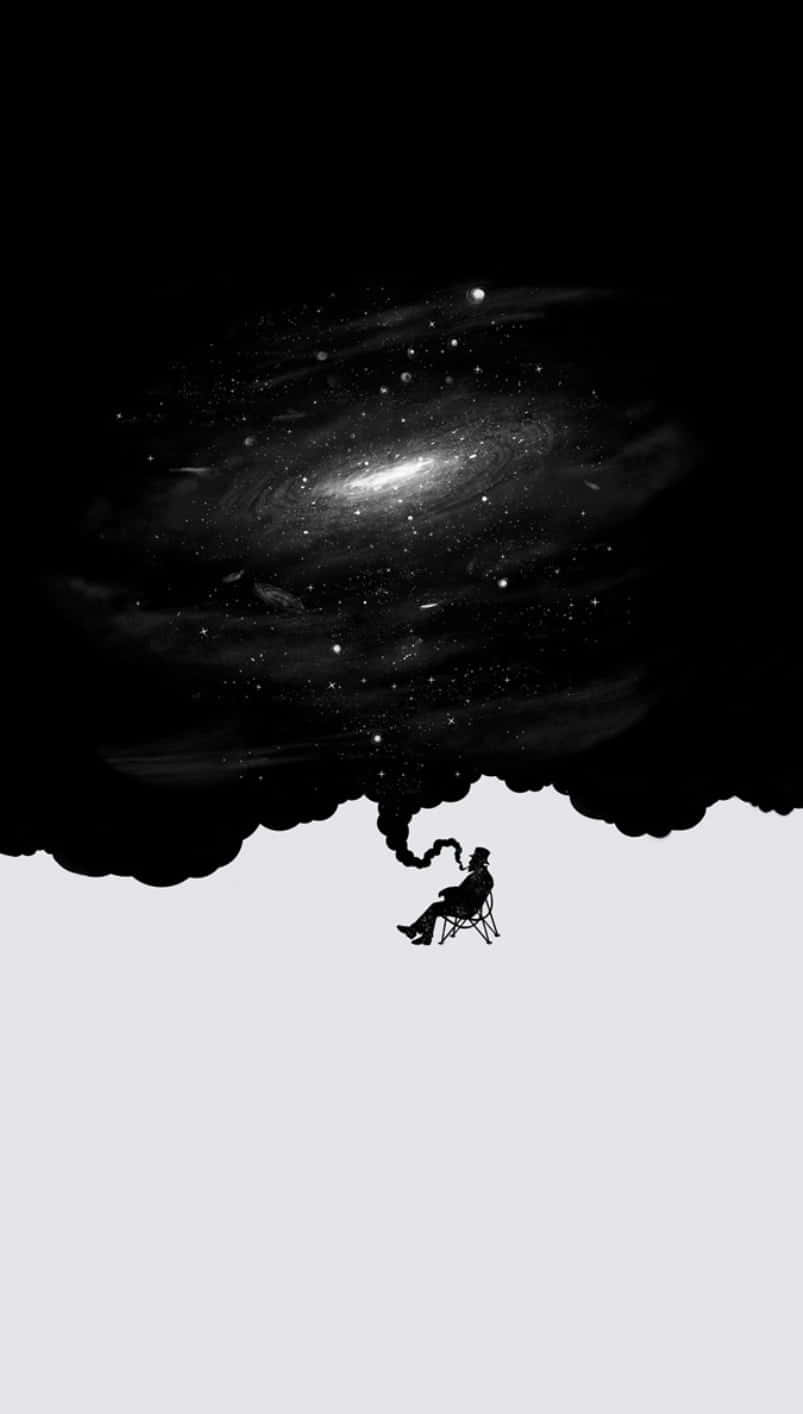 Half Black Half White 桌布 壁紙 — 一個孤獨的身影坐在椅子上，下方是旋轉的星系，仰望上方，宇宙塵埃在周圍飄浮。