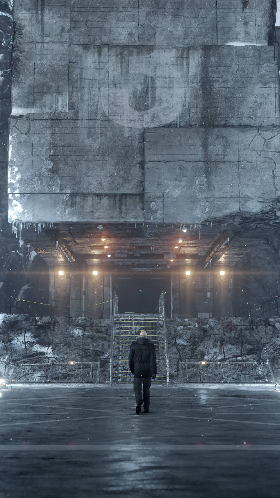 Building 桌布 壁紙 — 一個孤獨的身影穿著深色外套，在冰冷、下雪的天空下，走向一個巨大、裂開的混凝土結構，結構上有發光的燈光。