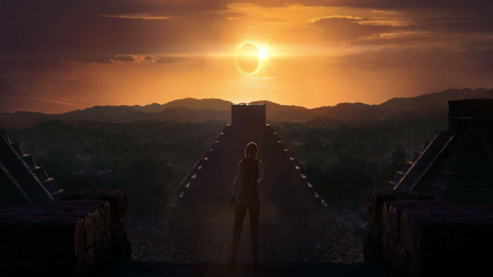 1080p Shadow Of The Tomb Raider 桌布 壁紙 — 一個孤獨的身影站在古老的石階頂端，面對著山巒地平線上戲劇性的日食。