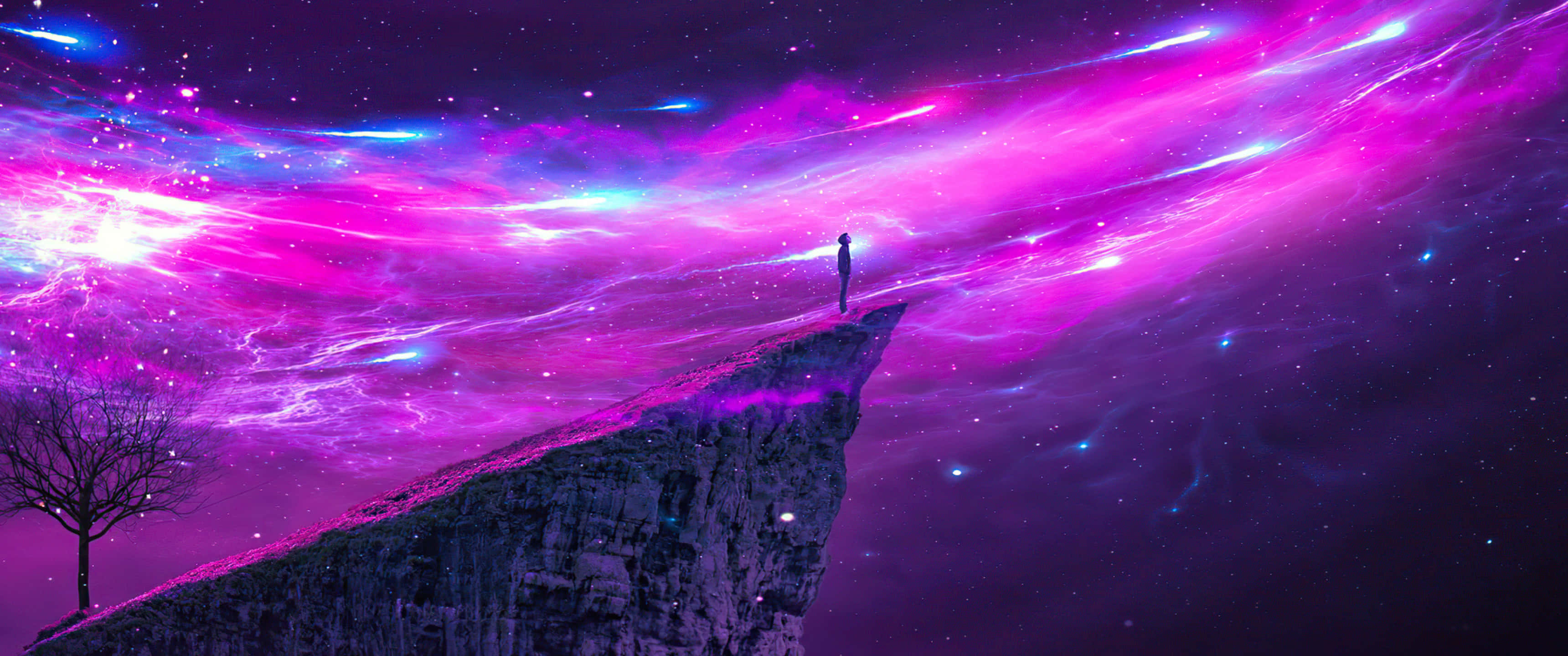 Ultra Wide 3440x1440 Space 桌布 壁紙 — 一個孤獨的身影站在懸崖邊，下方是旋轉的宇宙天空，充滿洋紅色和電光藍色的星雲。