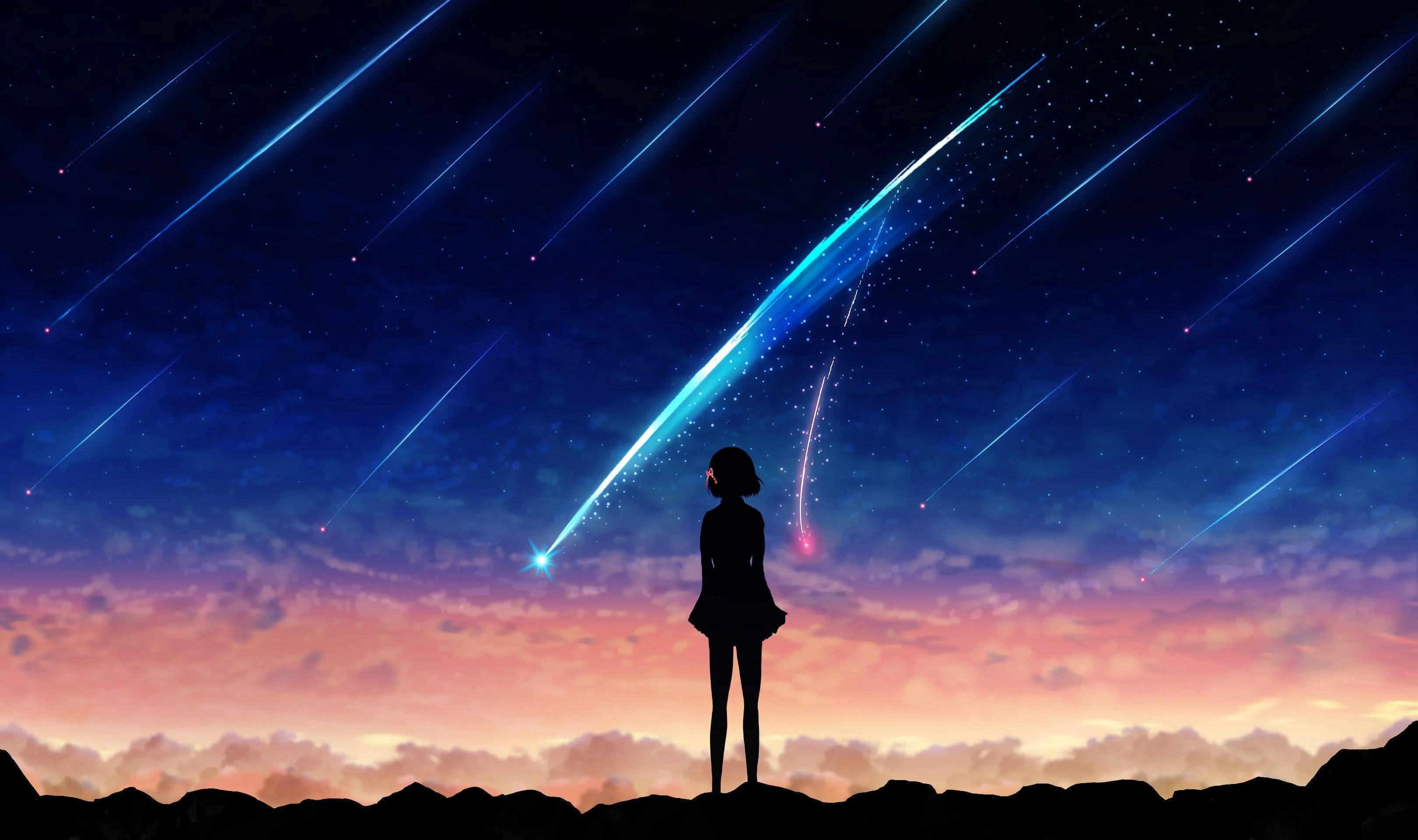 Makoto Shinkai 桌布 壁紙 — 一個孤獨的身影站在懸崖頂上，看著鮮豔的藍色流星劃過佈滿星辰的暮色天空。