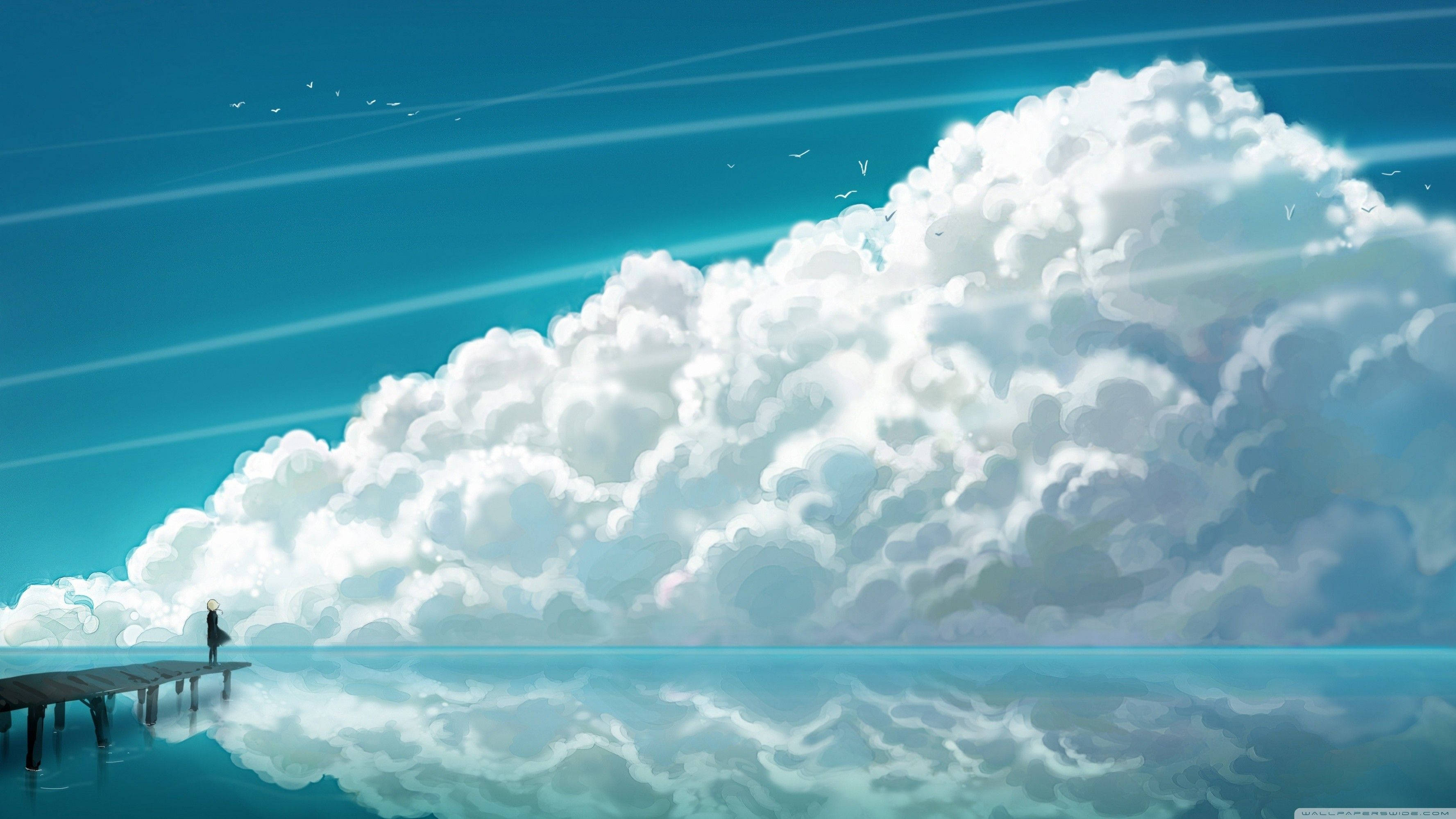 Aesthetic Cloud 桌布 壁紙 — 一個孤獨的身影站在木碼頭的盡頭，凝視著在晴朗藍天下平靜的碧綠海水中倒映的巨大雲層。