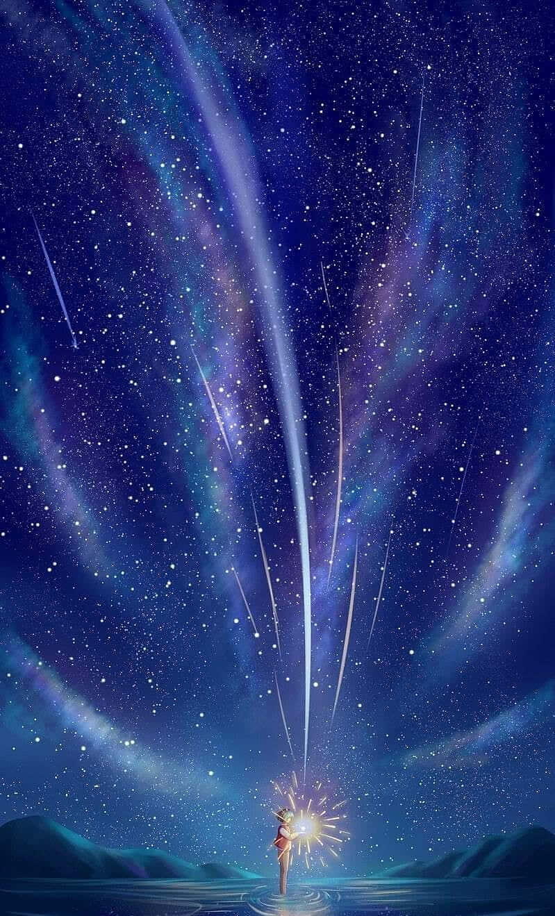 Shooting Stars 桌布 壁紙 — 一個孤獨的身影站在水中，手持仙女棒，流星劃過充滿活力的宇宙夜空。