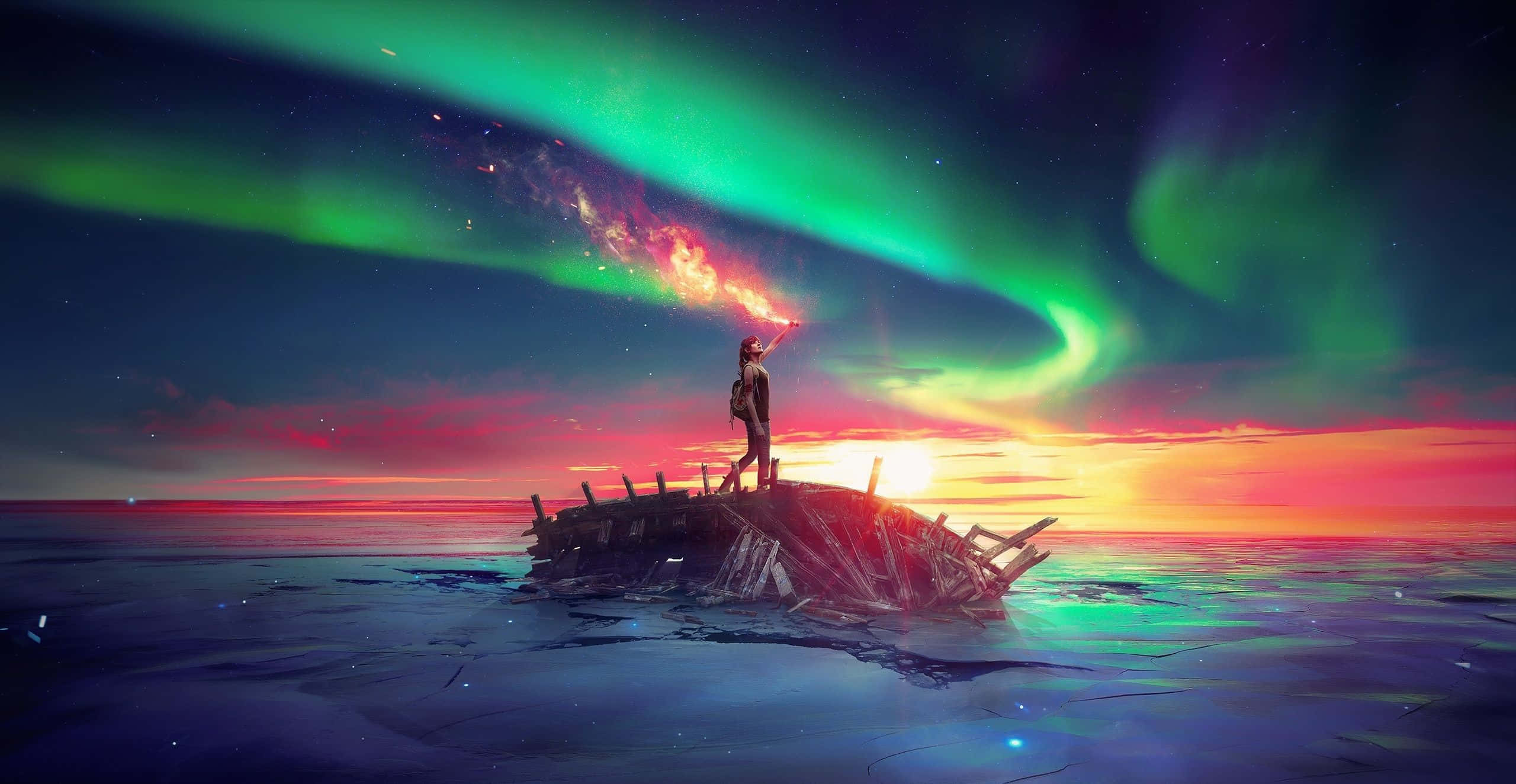 Breathtaking 桌布 壁紙 — 一個孤獨的身影站在沉船殘骸上，上方是舞動在繁星暮色天空中的絢麗北極光。
