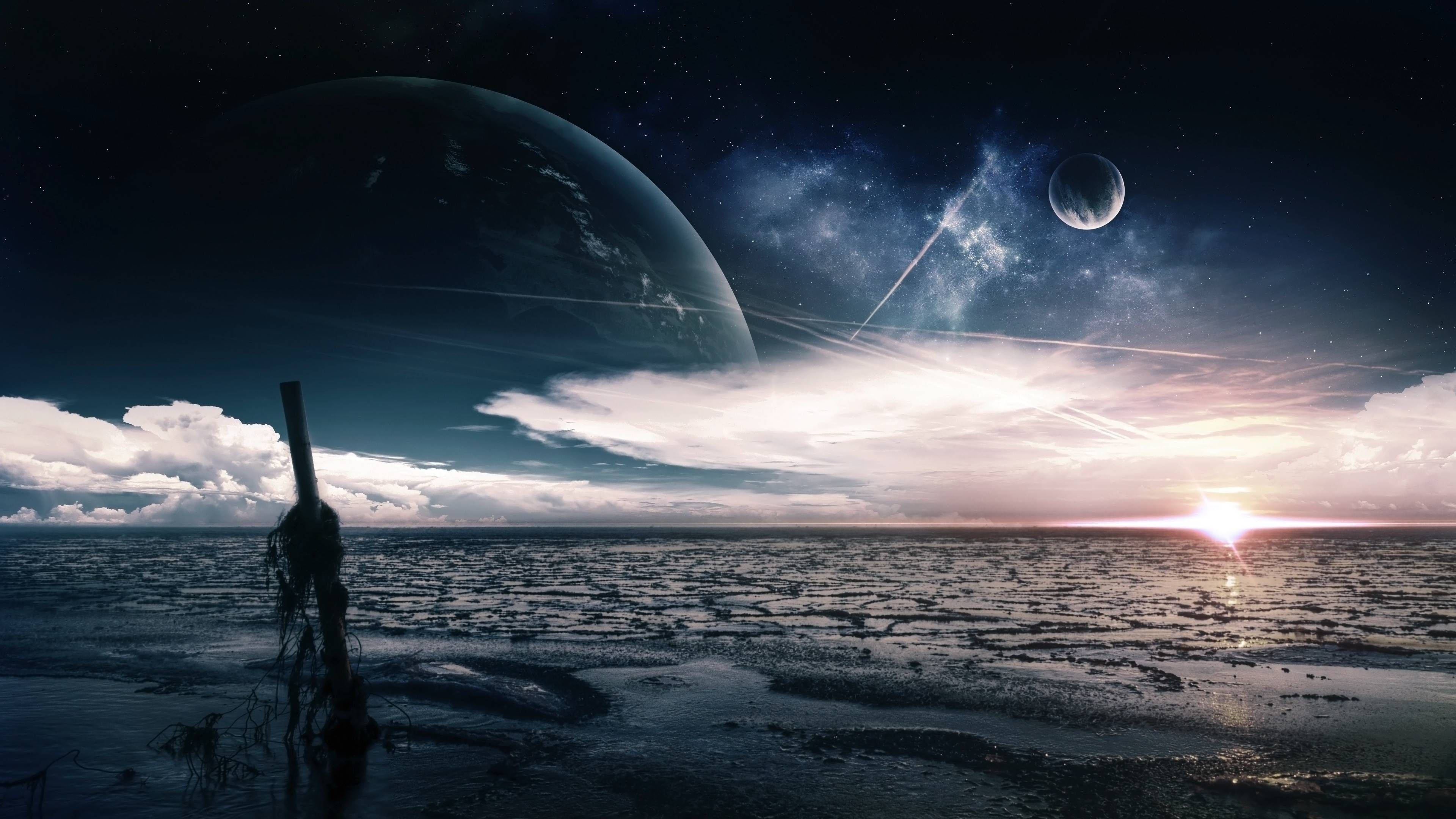 行星動畫 桌布 壁紙 — 一個孤獨的身影站在荒涼的外星海岸上，一顆巨大的行星在宇宙日出時籠罩在頭頂。