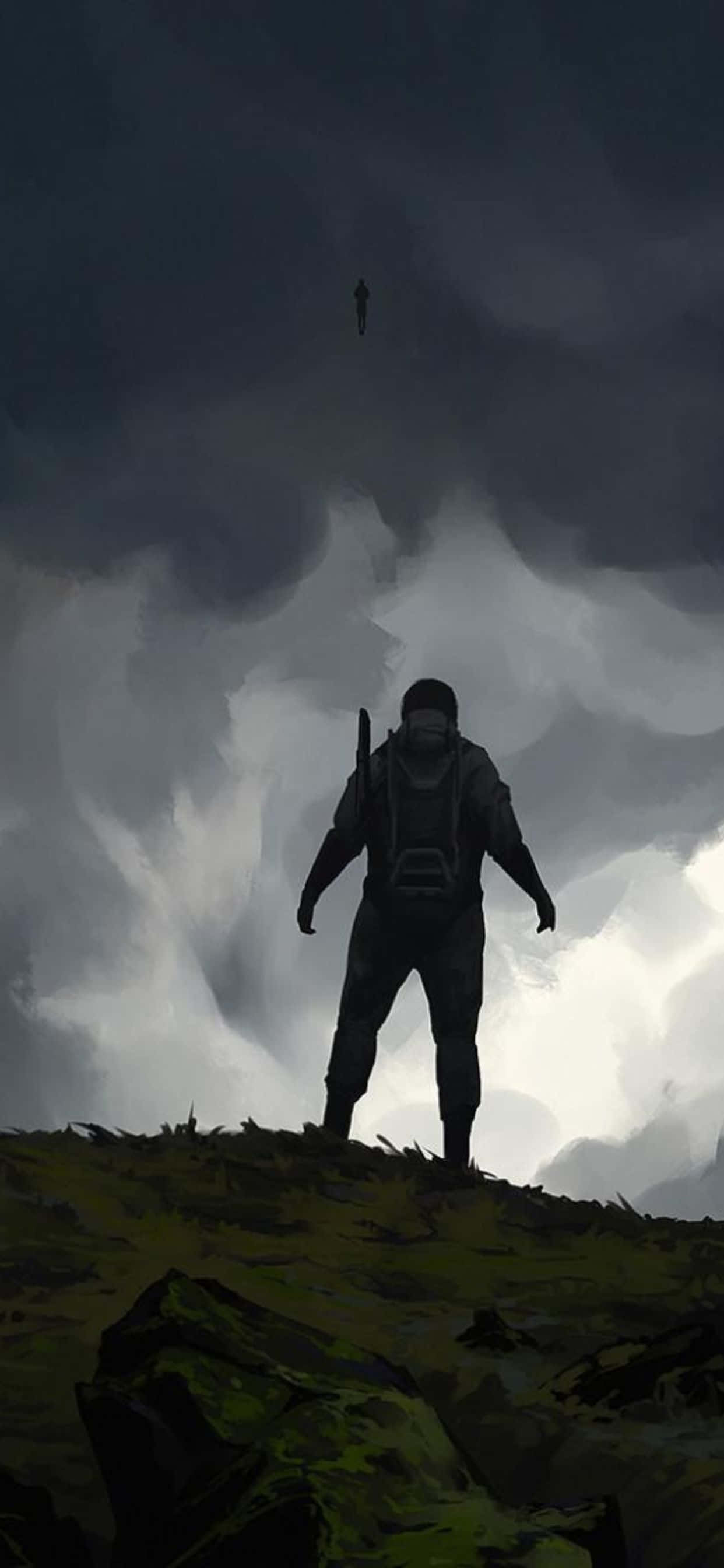 iPhone Xs Max Death Stranding 桌布 壁紙 — 一個孤獨的身影站在長滿草的山丘上，頭頂是廣闊的暴風雨天空，遠處另一個剪影漂浮在上方。