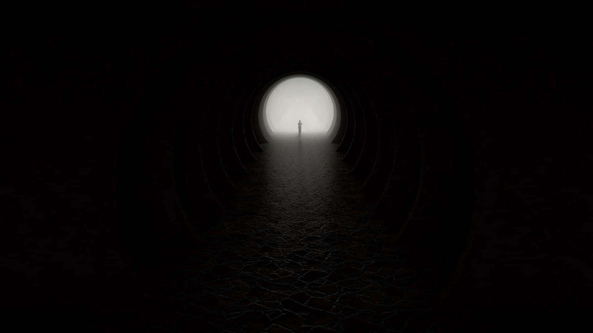 Silhouette 桌布 壁紙 — 一個孤獨的身影站在黑暗圓形隧道的盡頭，沐浴在發光圓形出口的柔和光線中。